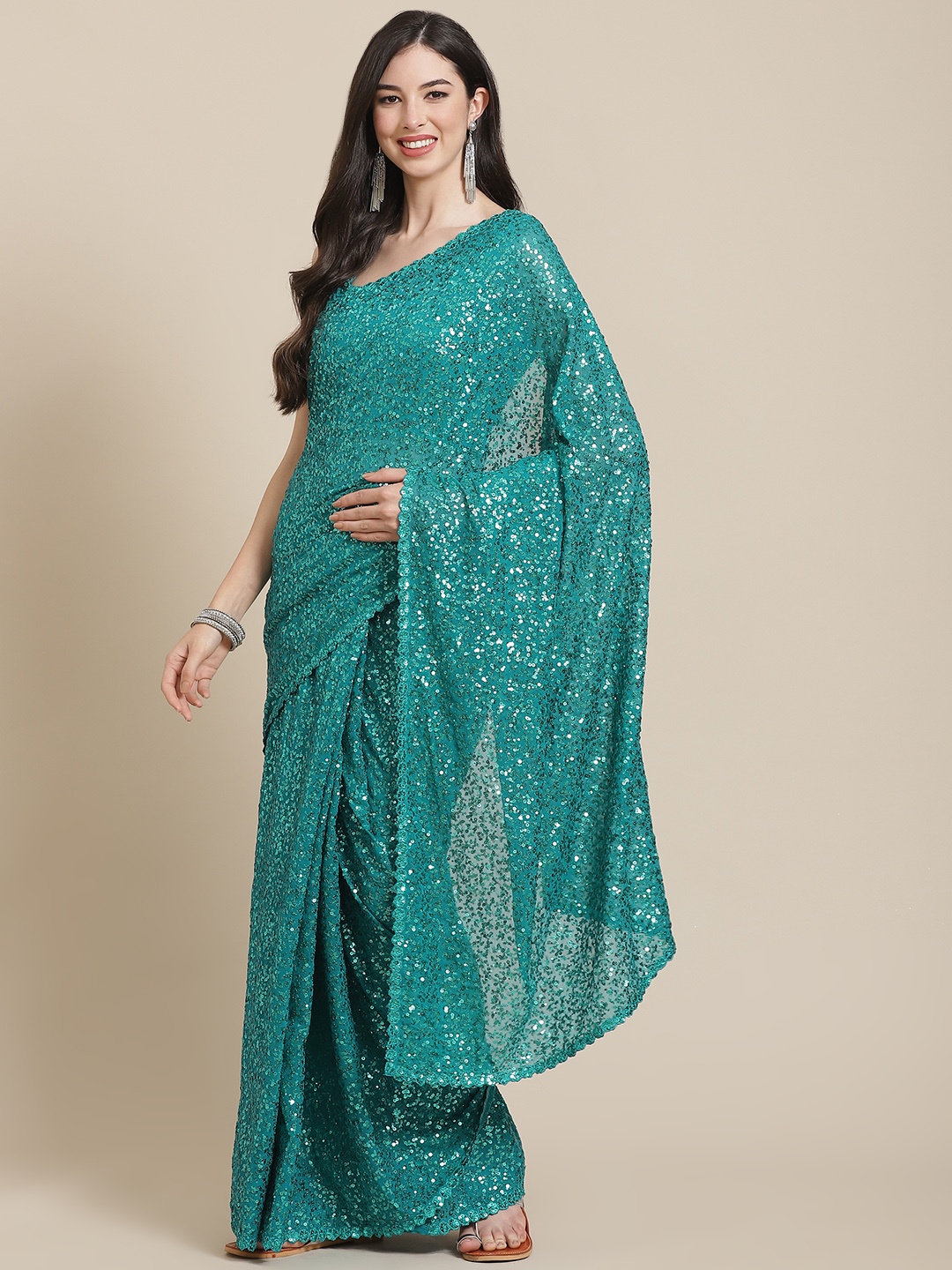 

Readiprint Fashions Turquoise Blue Sequinned Pure Georgette Heavy Work Saree