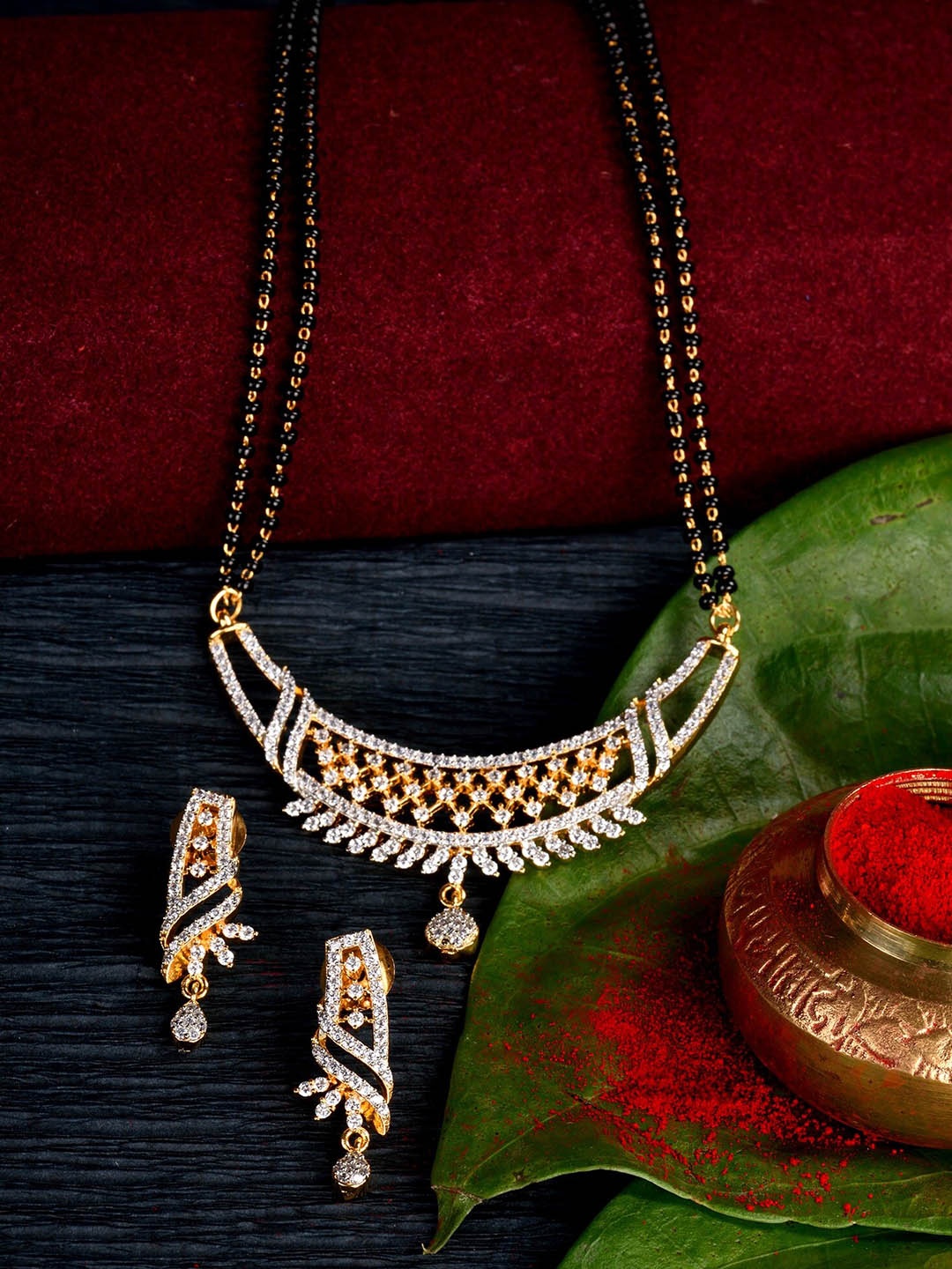 

Saraf RS Jewellery White & Black-Toned Gold-Plated AD Studded Mangalsutra Jewellery Set