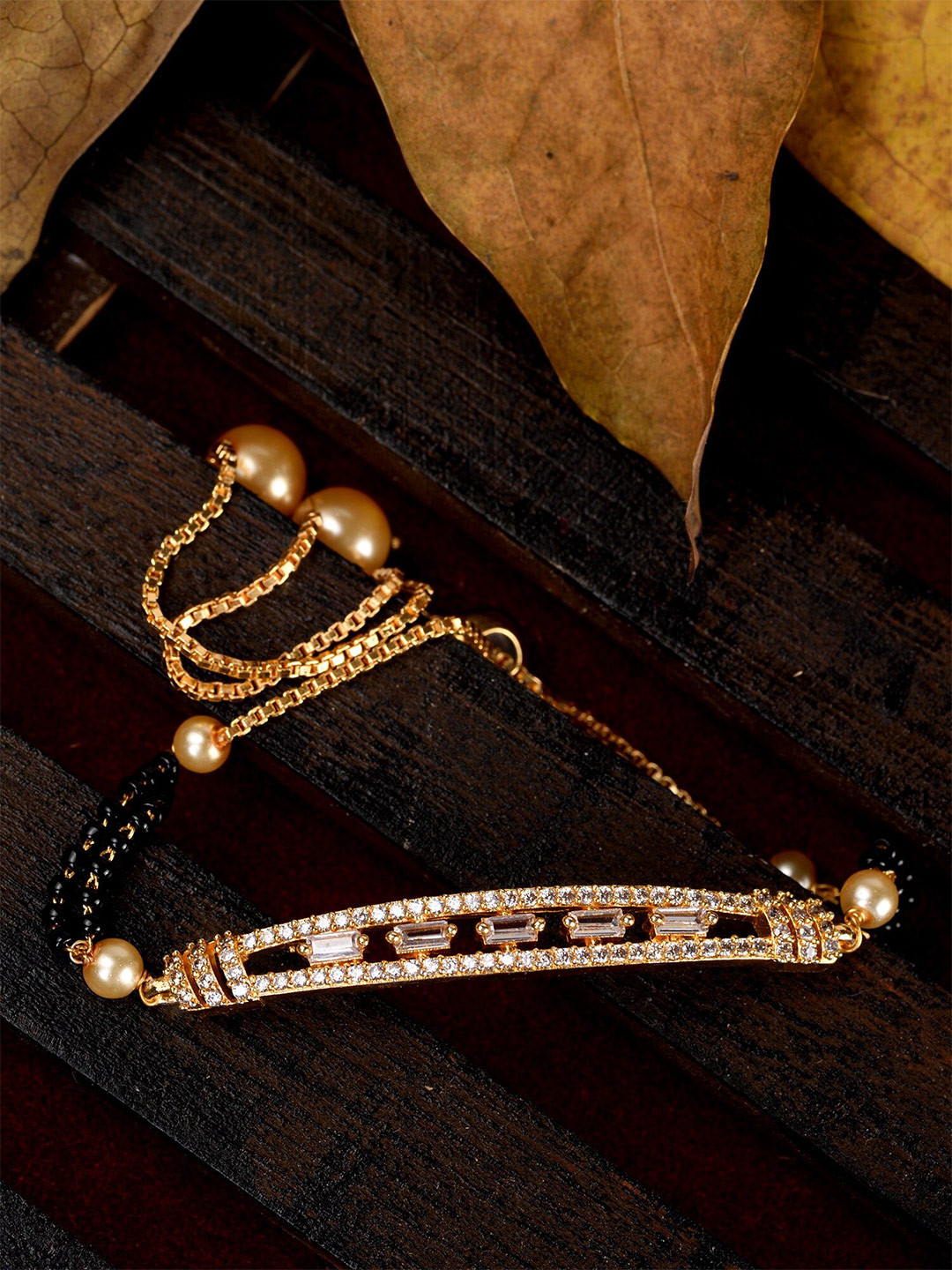 

Saraf RS Jewellery Women White & Gold-Toned Brass American Diamond Gold-Plated Wraparound Bracelet