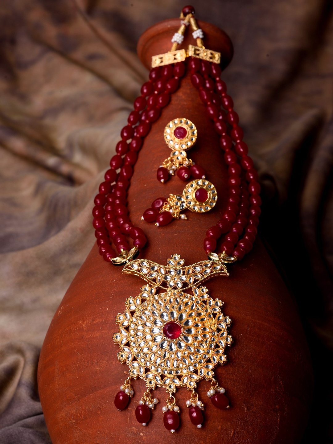 

Saraf RS Jewellery Gold Plated Red & White Stone Studded Beaded Multilayer Jewellery Set