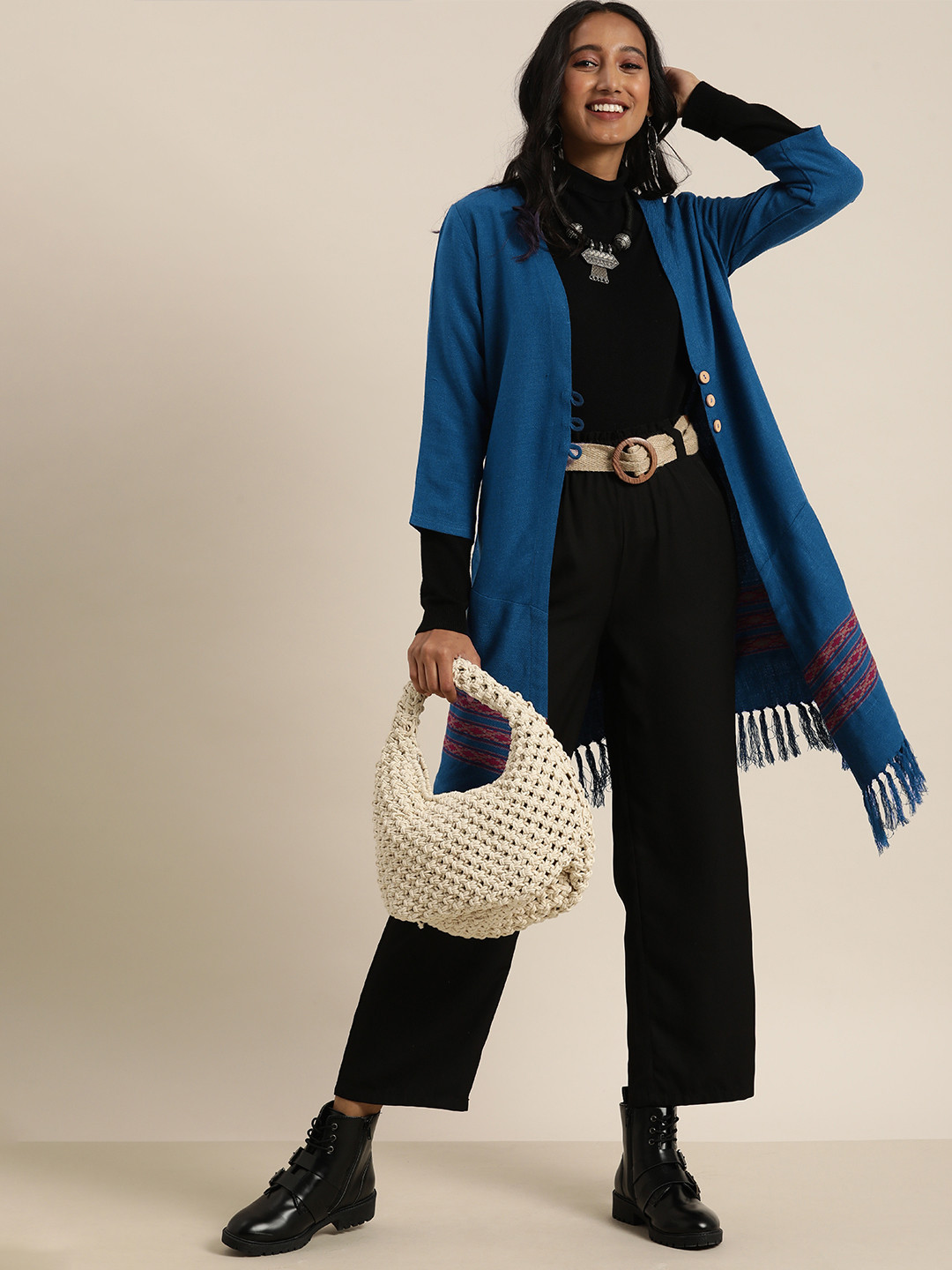 

Taavi Women Blue Solid Bhujodi Winterwear Longline Button Shrug With Tasselled Detail