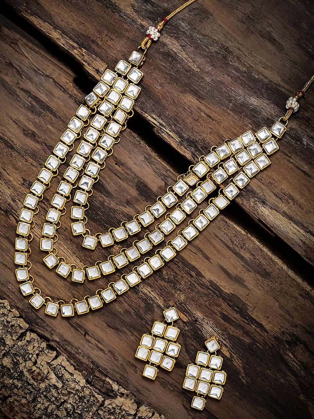 

Zaveri Pearls Gold Toned Multi Layered White Kundan Studded Jewellery Set