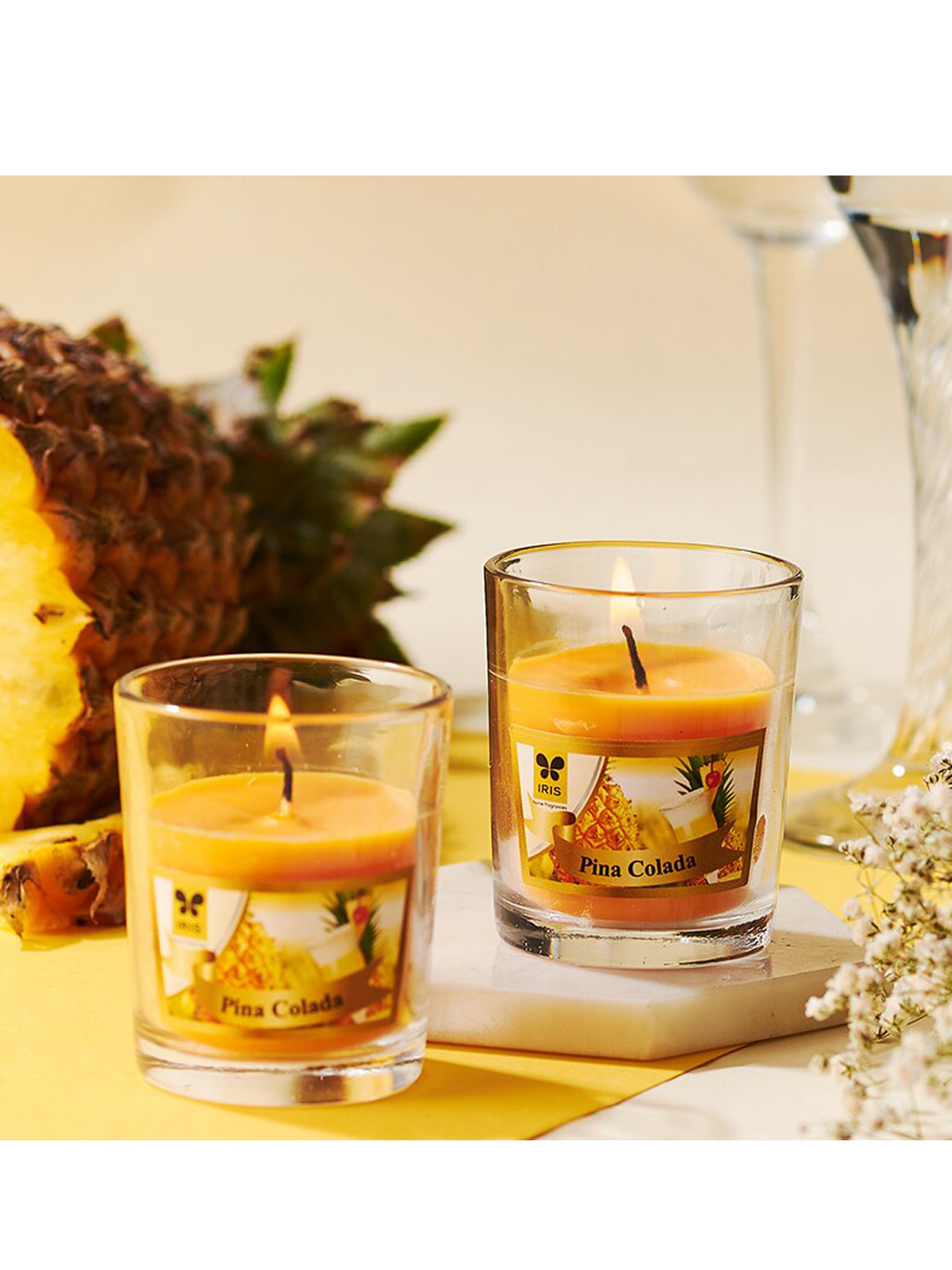 

Iris Set Of 2 Orange Pina Colada Scented Glass Candles