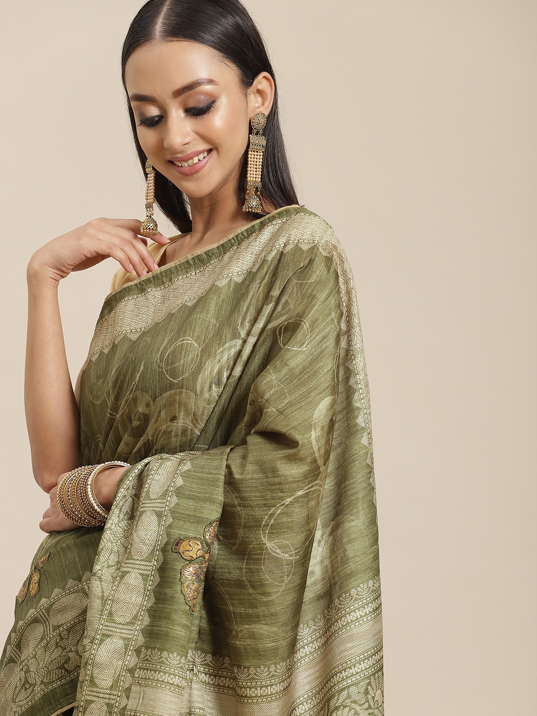 

Mitera Green & Beige Ethnic Motifs Art Silk Saree