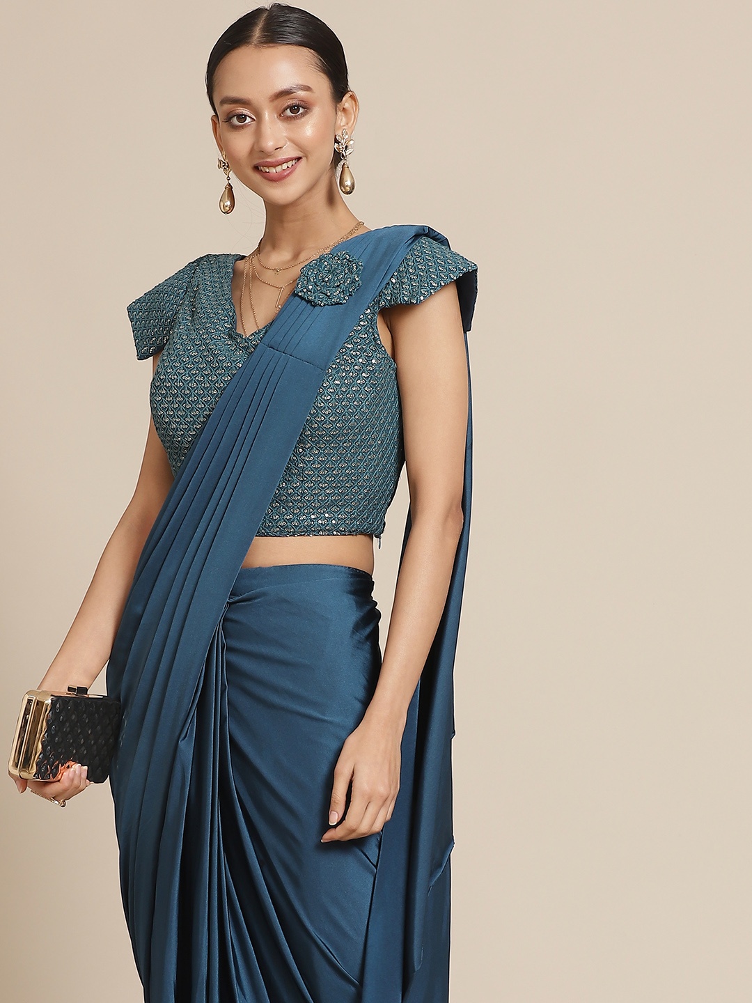 

Mitera Teal Blue Solid Ready to Wear Saree