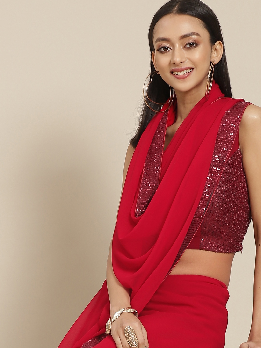 

Mitera Red Solid Sequinned Saree