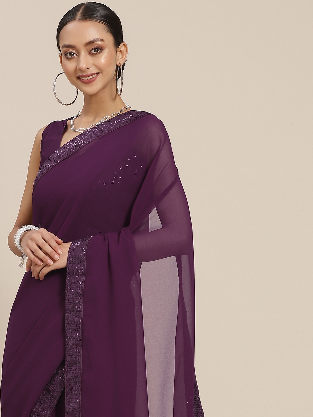 

Mitera Purple Solid Sequinned Saree