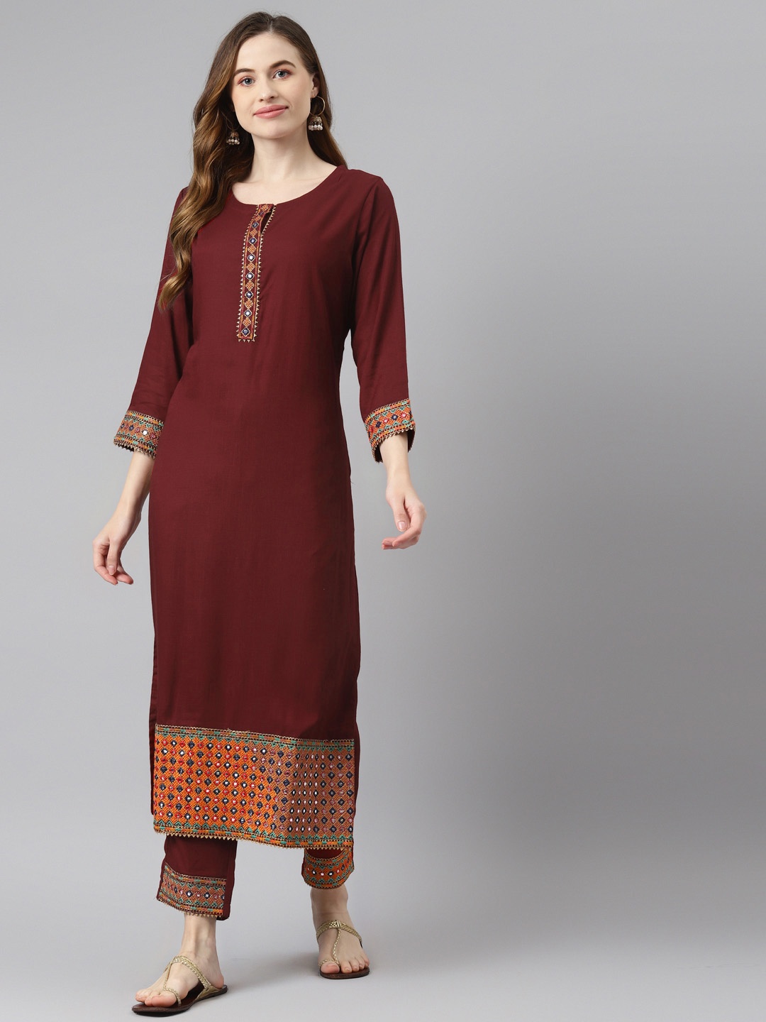 

Readiprint Fashions Women Maroon Solid Mirror Work Kurta with Trousers