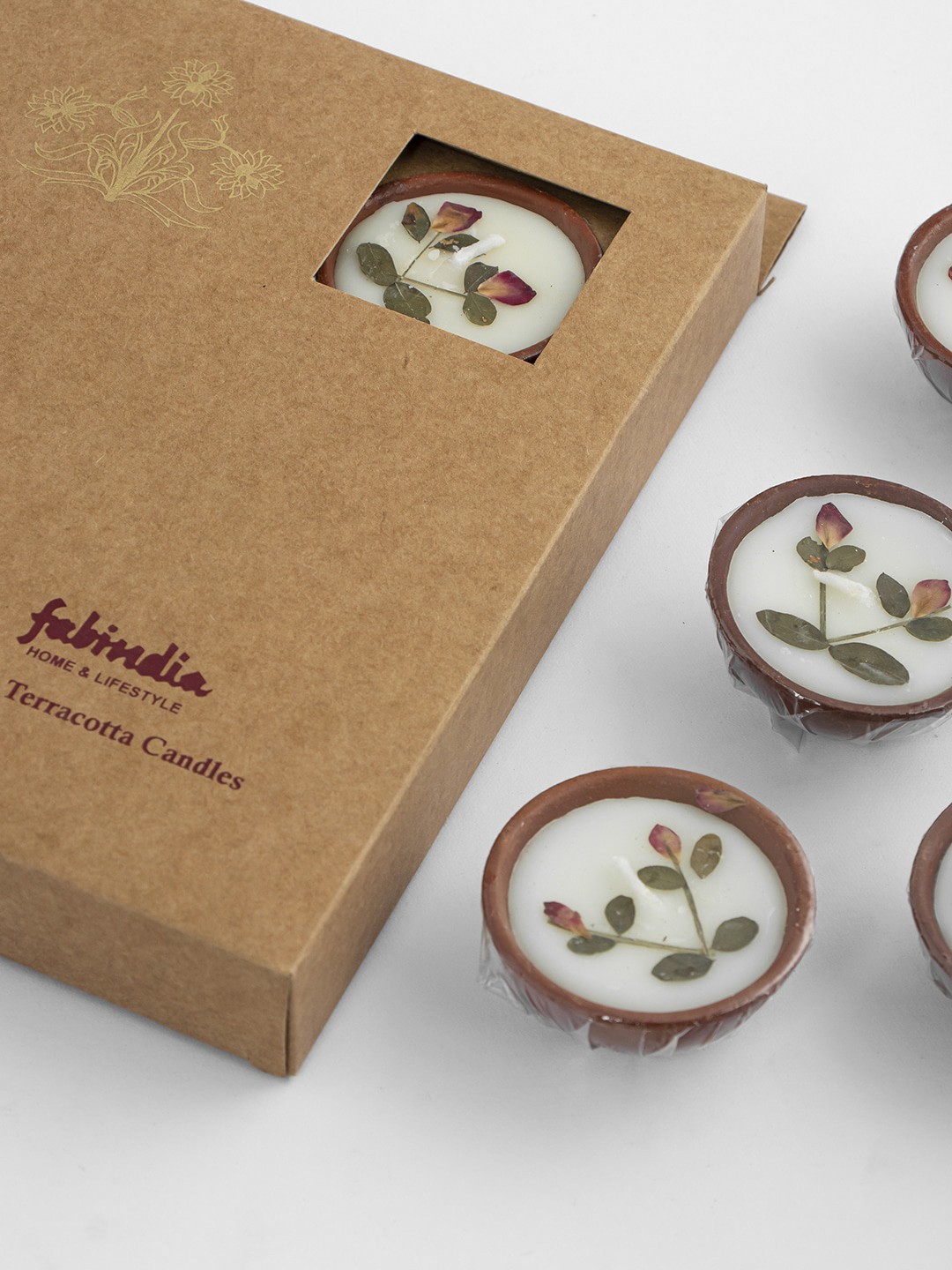 

Fabindia Set Of 6 Cream & Brown Patterned Candles With Terracotta Pots