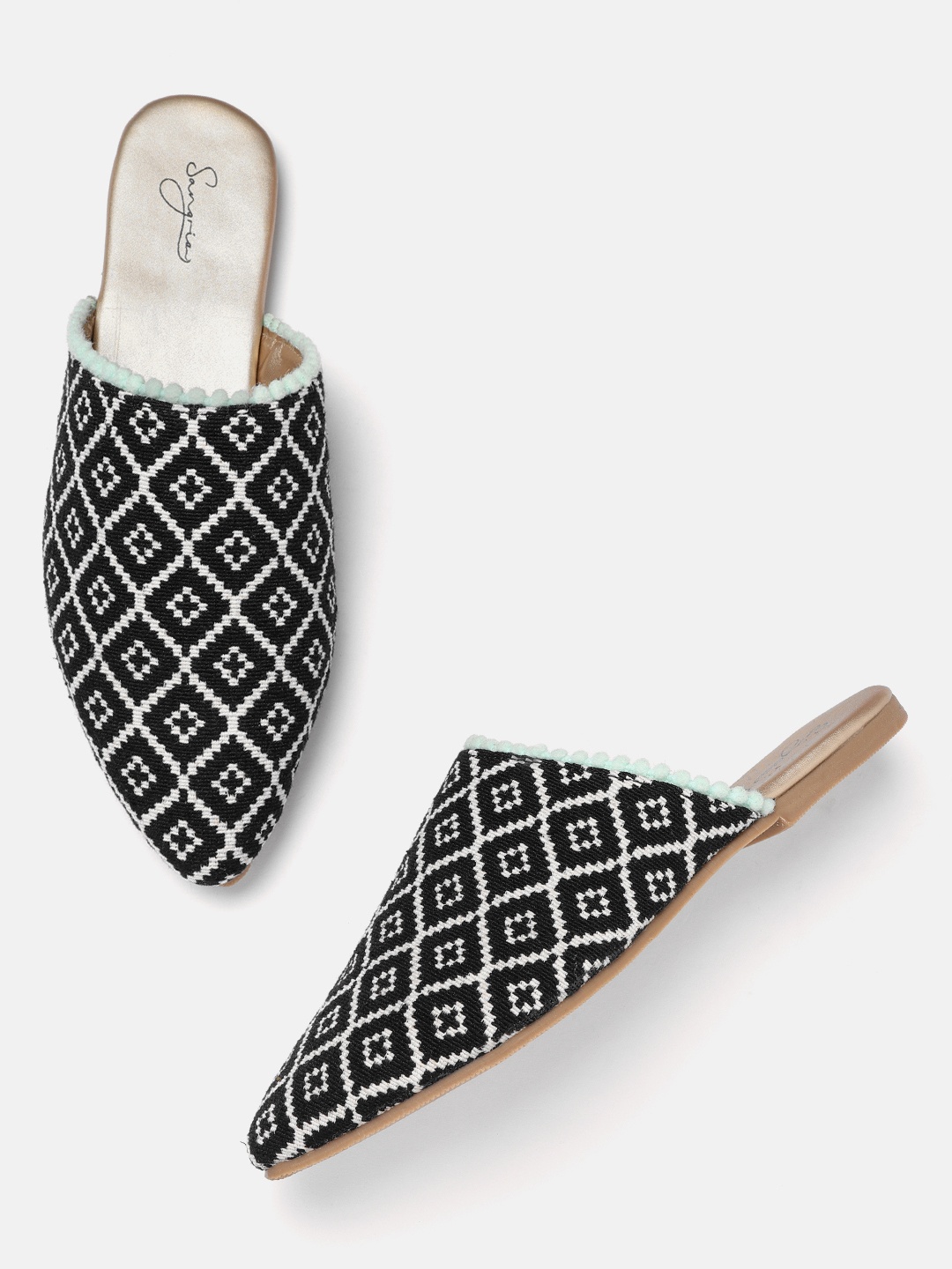 

Sangria Women Black & Off White Woven Design Mules