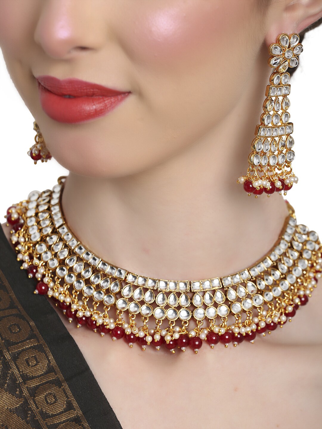 

Shining Diva Gold-Plated & White Kundan Stone Studded & Red Beaded Jewellery Set