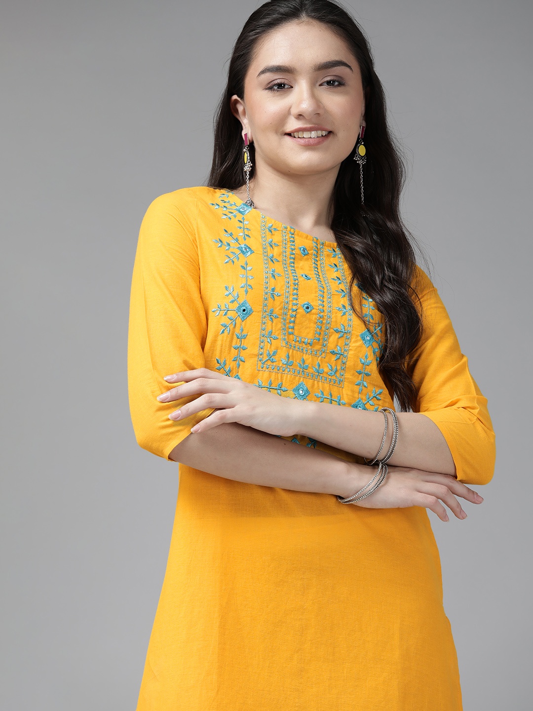 

ANMI Women Yellow & Blue Pure Cotton Embroidered Kurta With Mirror Work Details