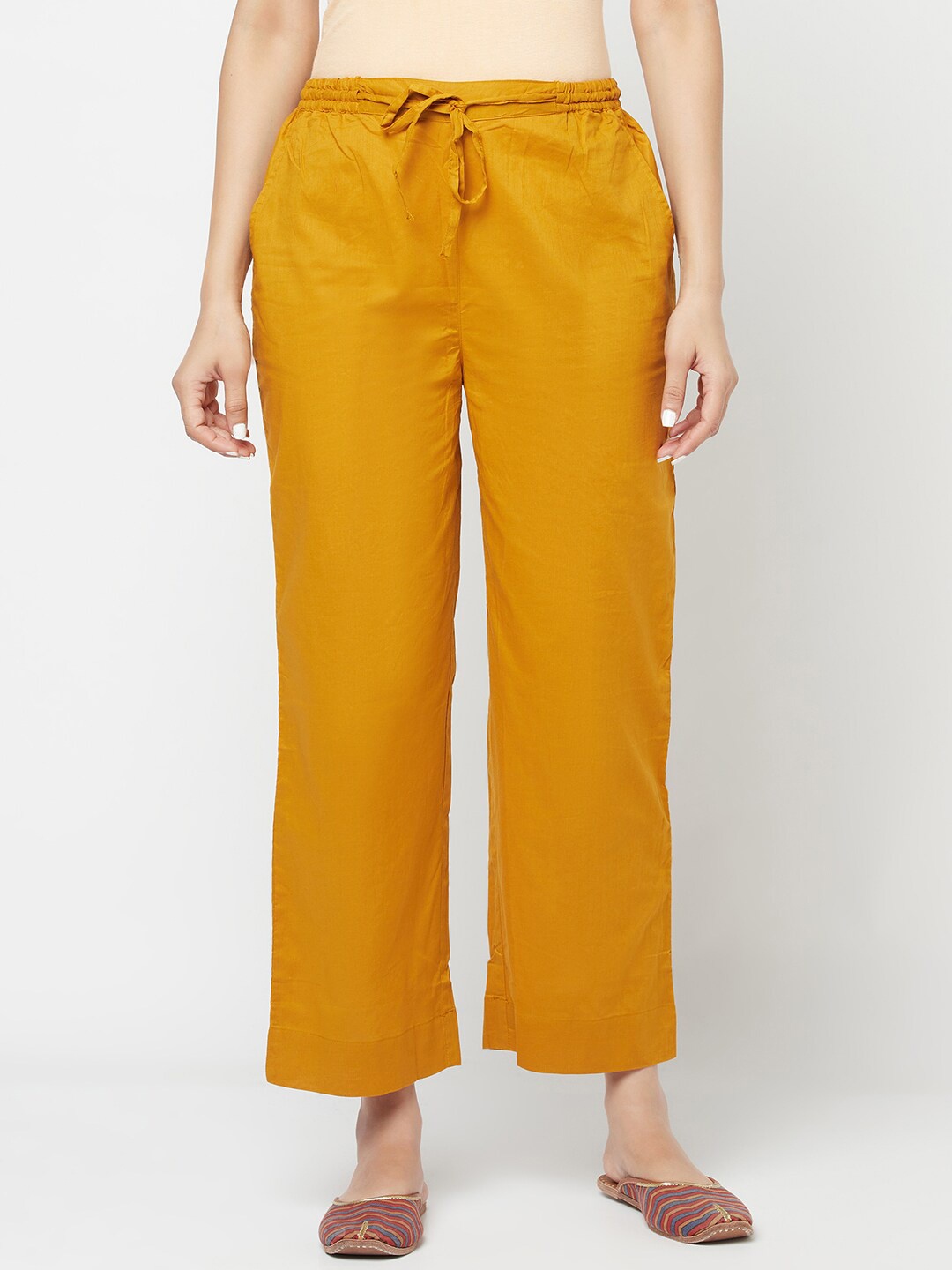 

Fabindia Women Mustard Yellow Cambric Cotton Palazzos