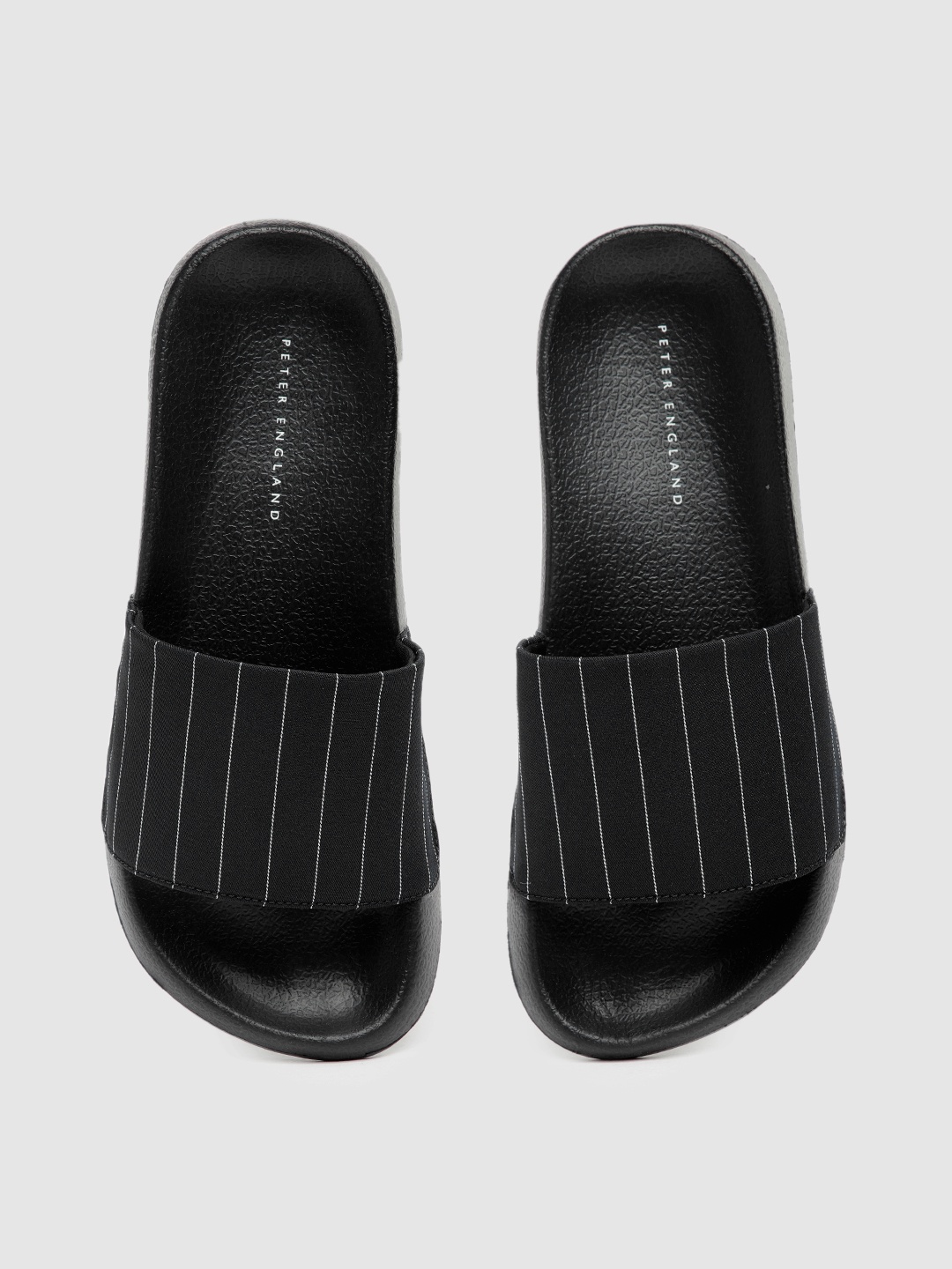 

Peter England Men Black & White Striped Sliders