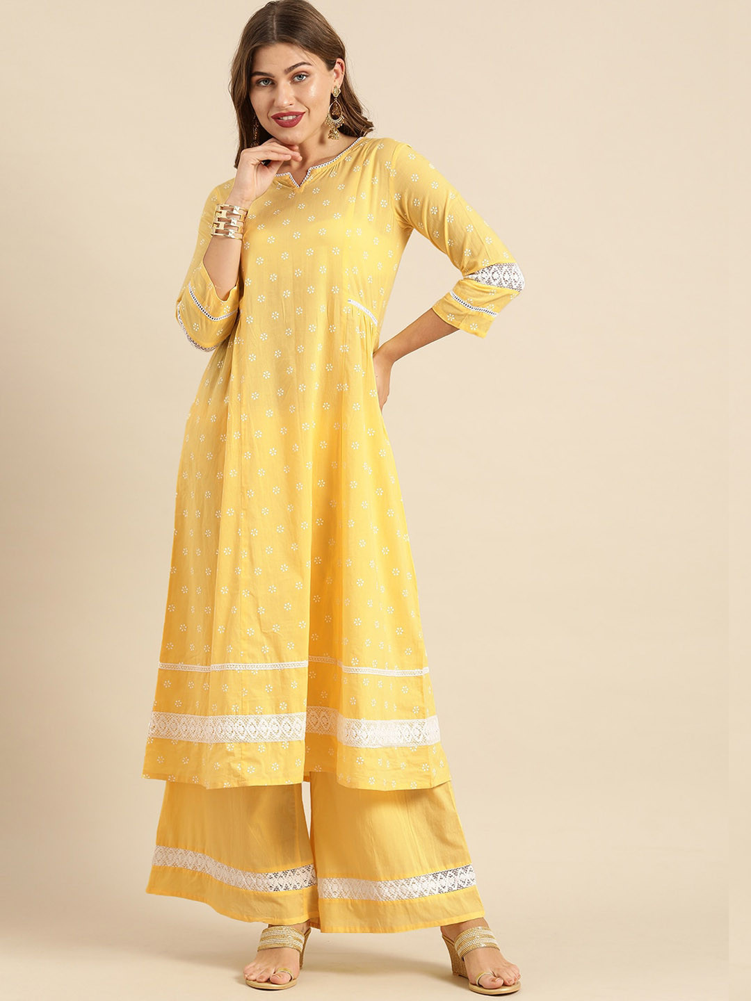 

Varanga Women Yellow Printed Regular Pure Cotton Kurta with Palazzos