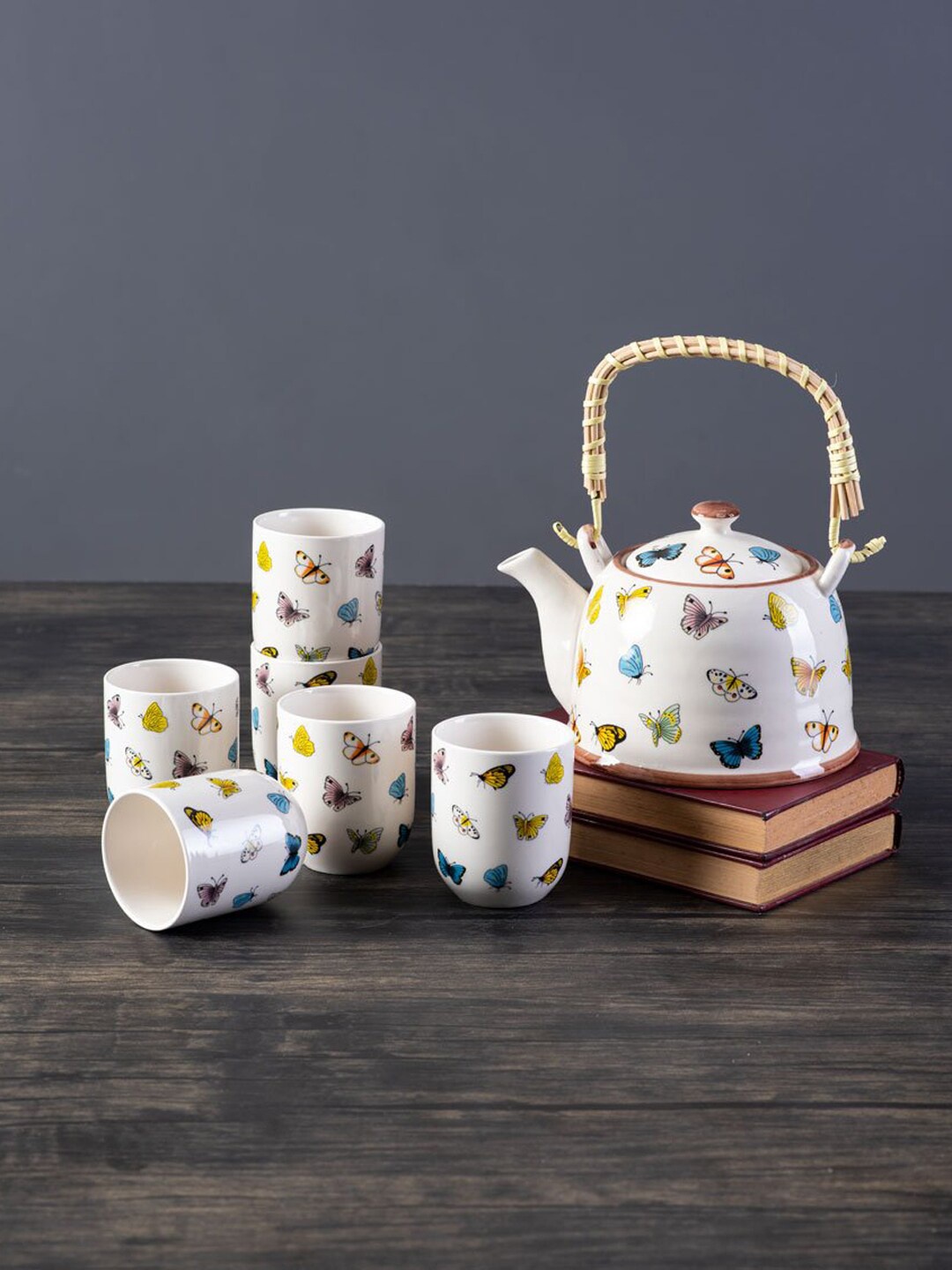 

THEDECORKART Set of 7 White & Yellow Printed Ceramic Glossy Cups and Kettle