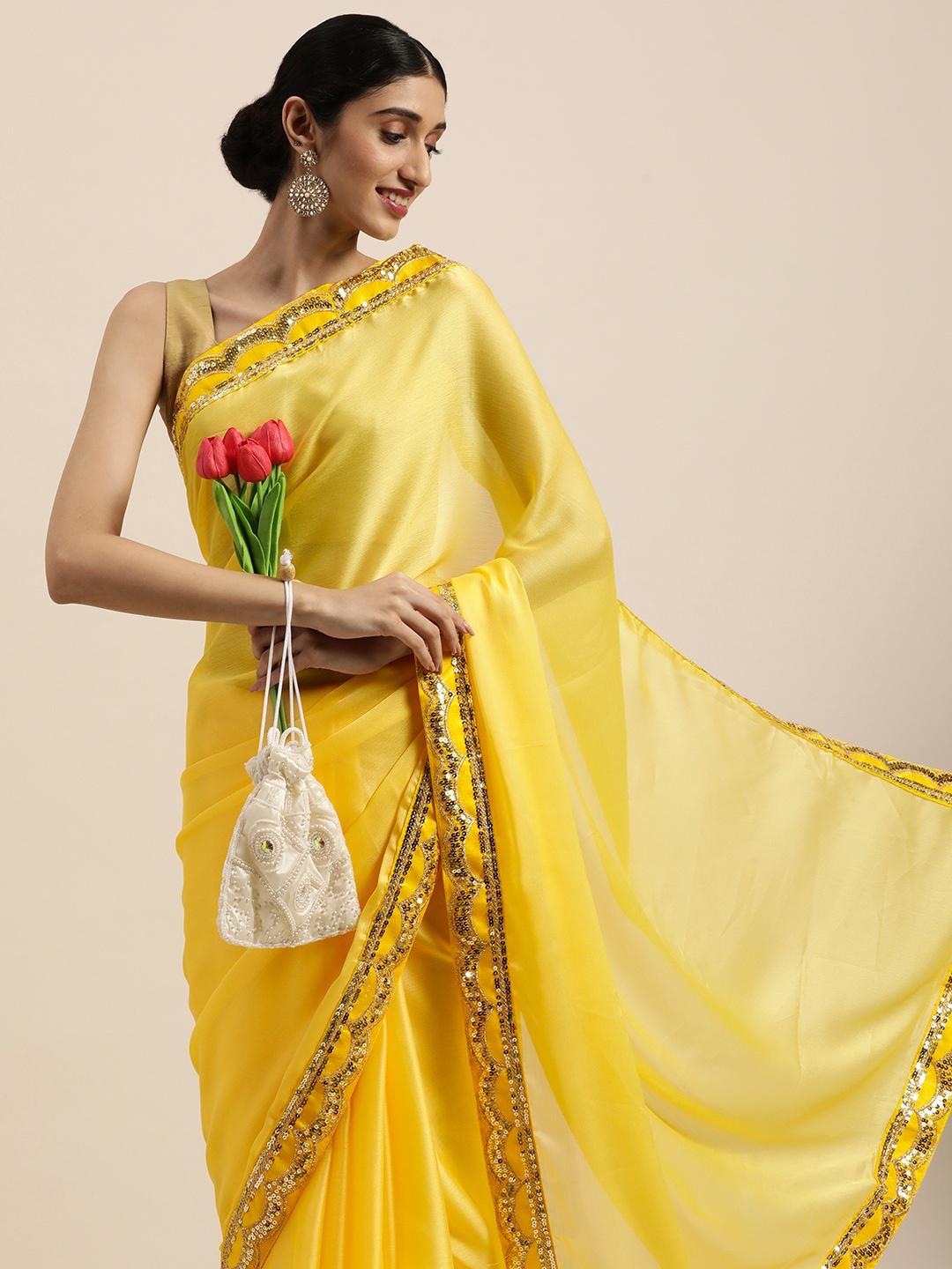 

VASTRANAND Yellow Ethnic Motifs Sequinned Saree