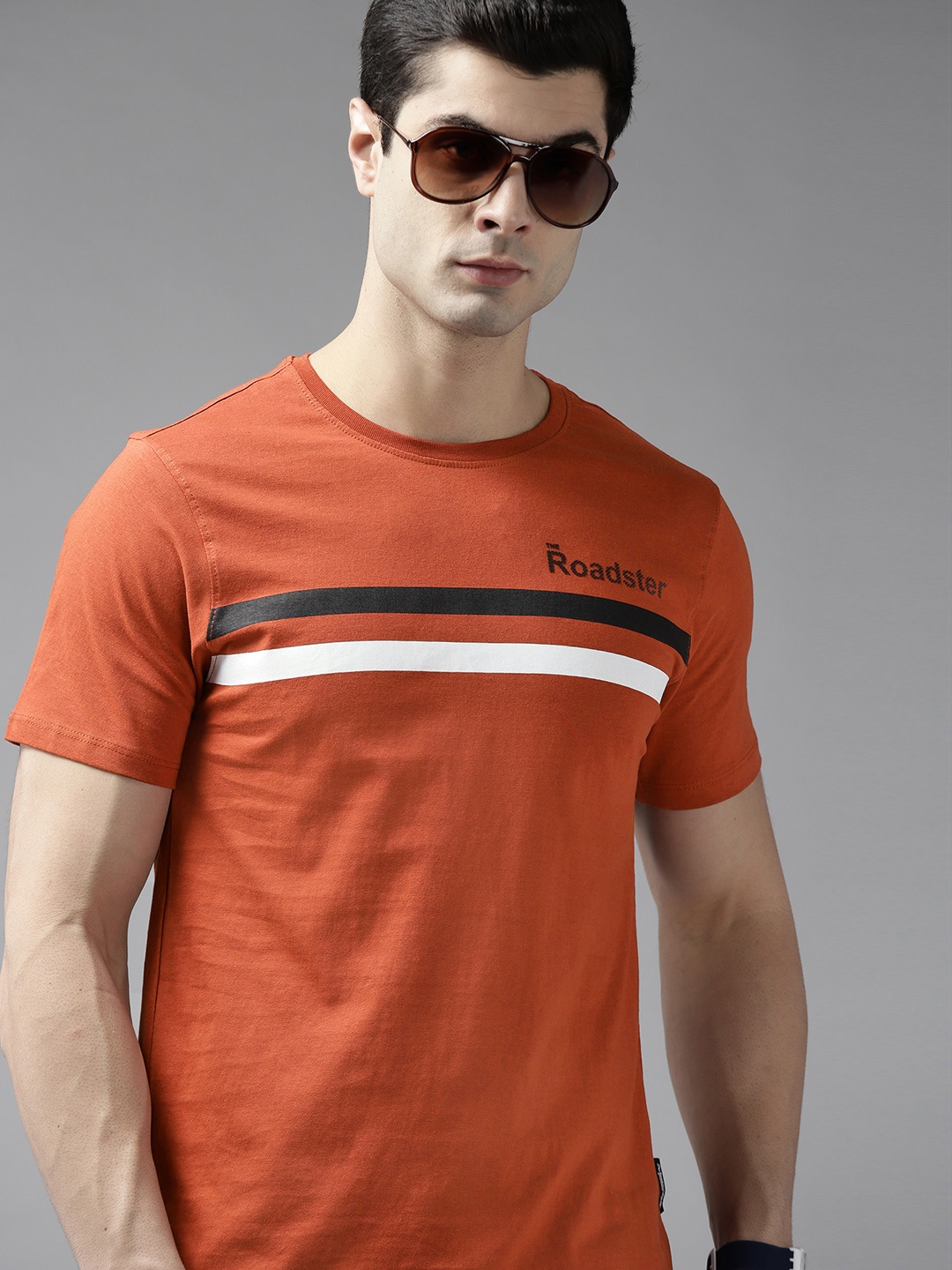 

Roadster Men Rust Orange & White Striped T-shirt