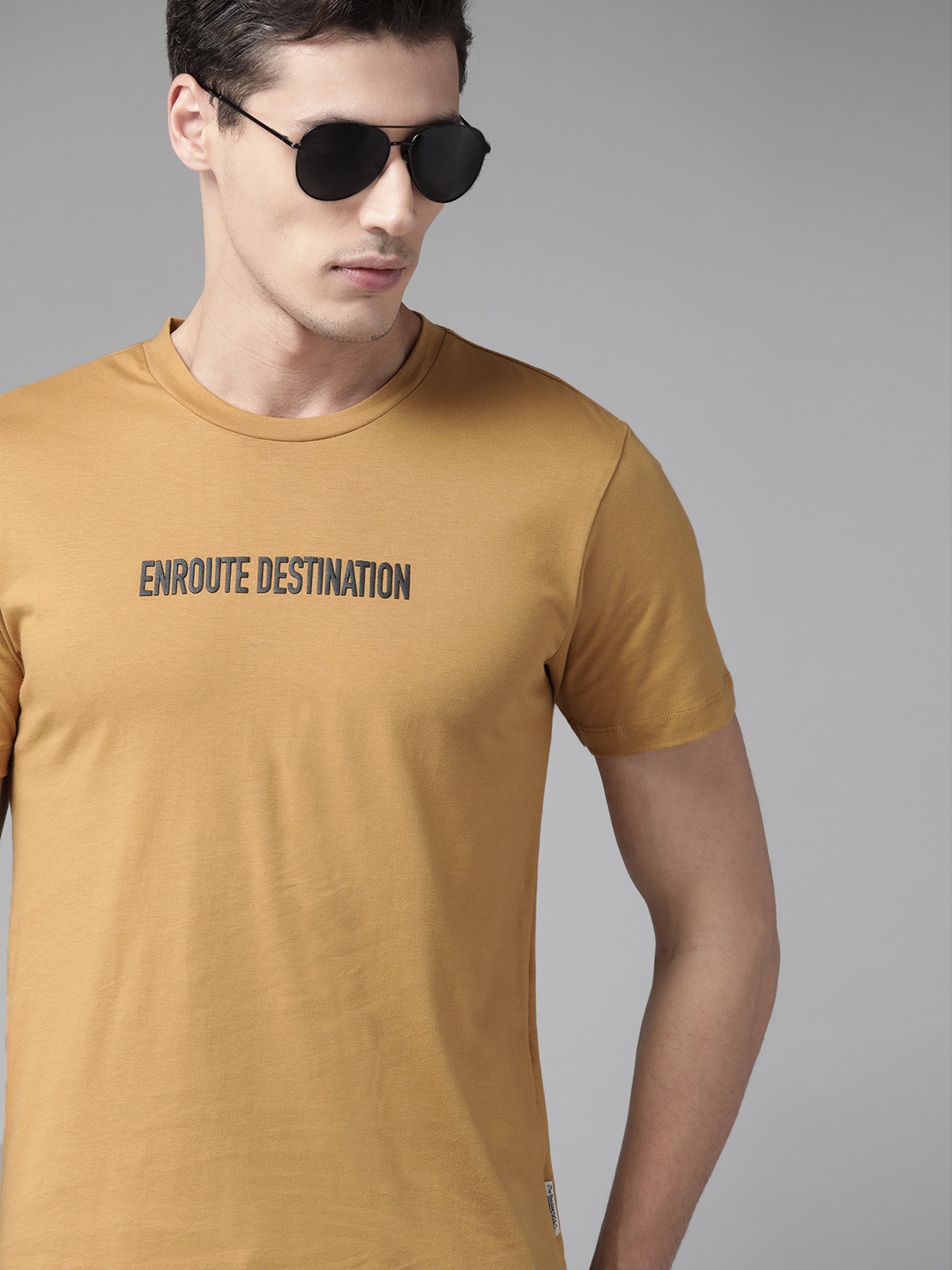 

The Roadster Lifestyle Co Men Mustard Yellow Pure Cotton Typography T-shirt