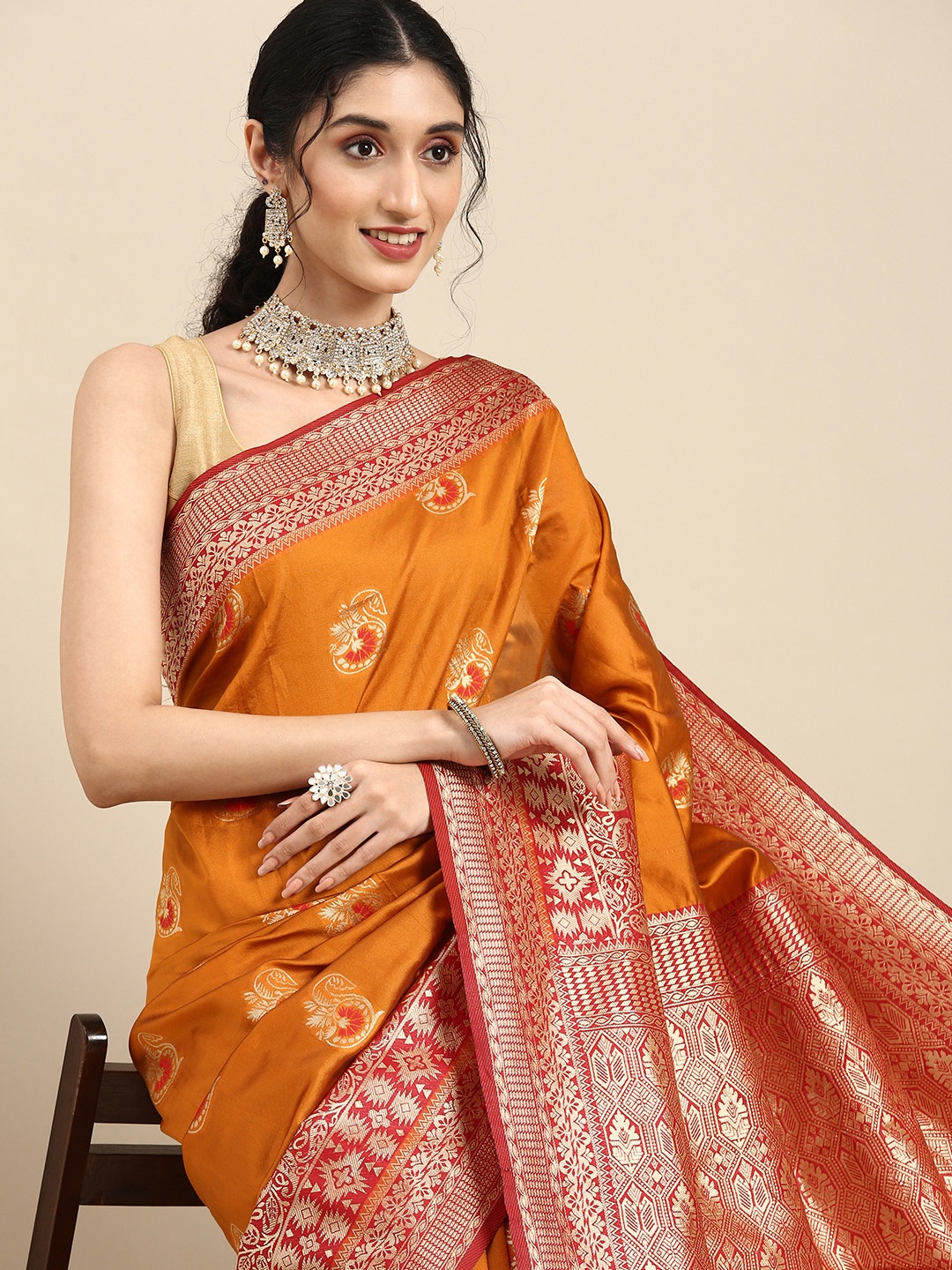 

Anouk Orange & Gold-Coloured Woven Design Zari Silk Blend Banarasi Saree