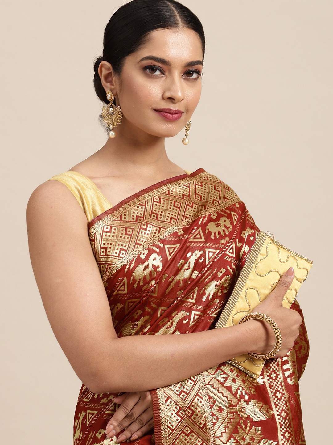 

Anouk Maroon & Gold-Toned Ethnic Motifs Zari Pure Silk Saree