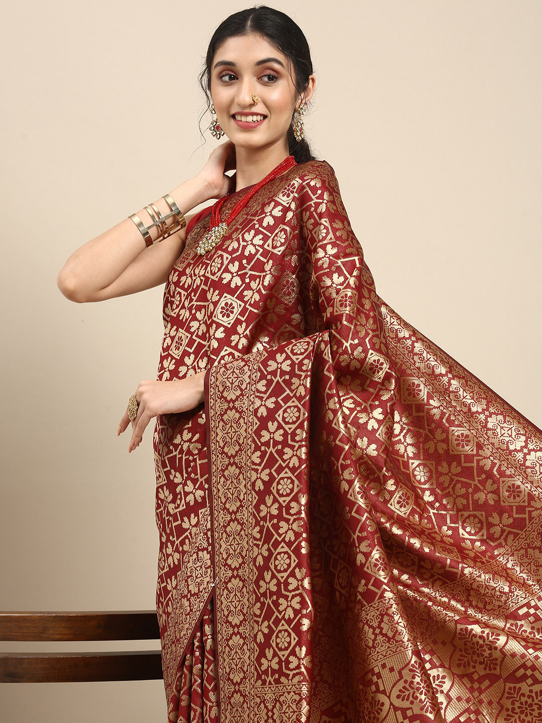 

Anouk Maroon & Gold-Toned Ethnic Motifs Zari Pure Silk Heavy Work Saree