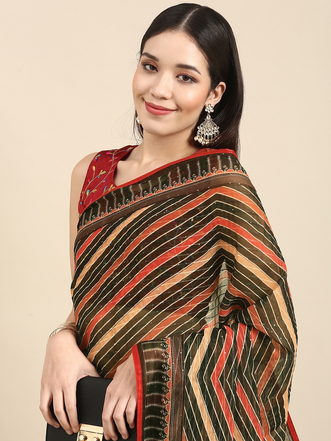 

Anouk Beige & Rust Brown Striped Sequinned Pure Georgette Saree