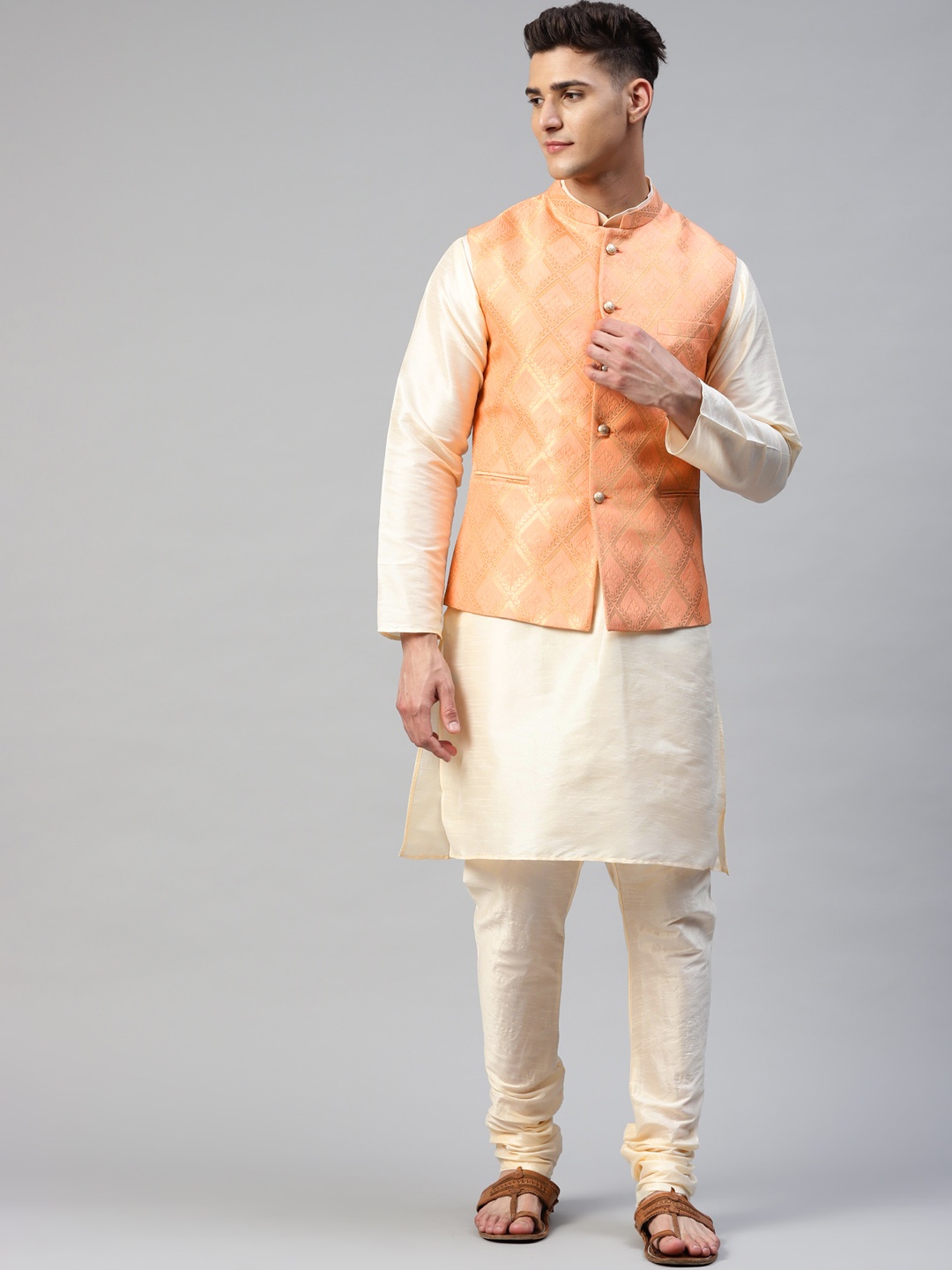 

MANQ Men Cream-Coloured & Peach Kurta with Churidar & Woven design Nehru Jacket