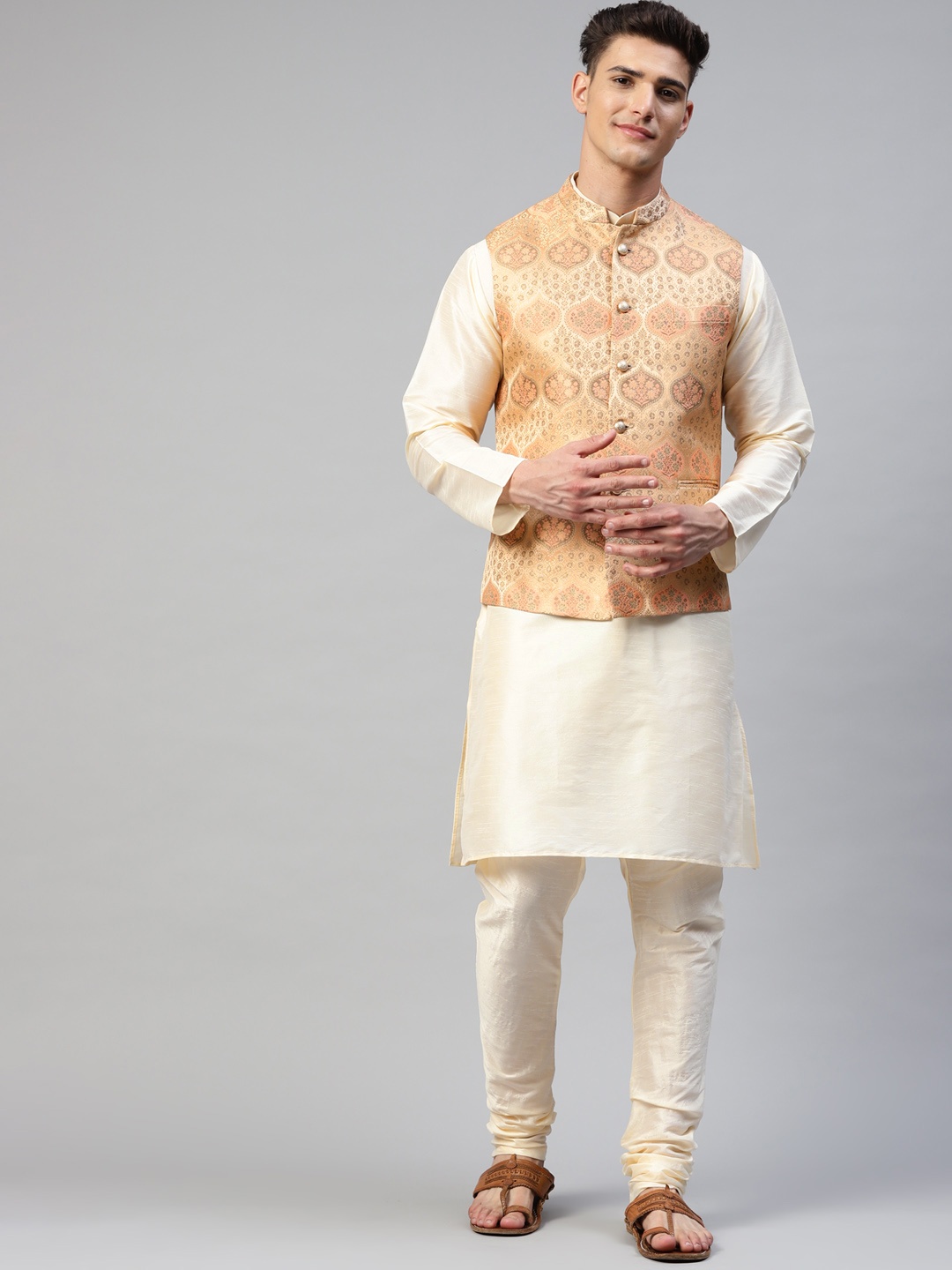 

MANQ Men Cream-Coloured & Peach Kurta with Churidar & Woven Design Nehru Jacket