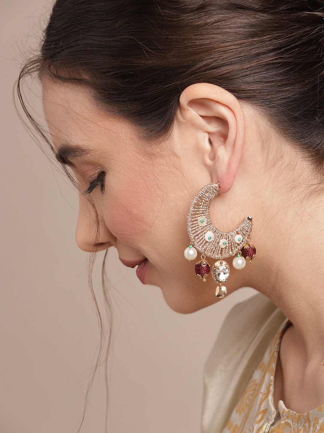 

Sangria Gold-Toned & Off White Stone Studded & Beaded Crescent Shaped Half Hoop Earrings