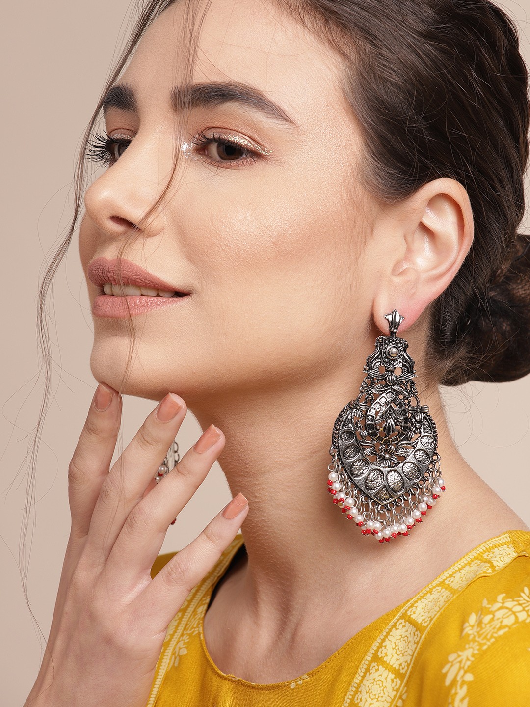 

Sangria Silver-Toned & Off White Oxidised Classic Ethnic Drop Earrings