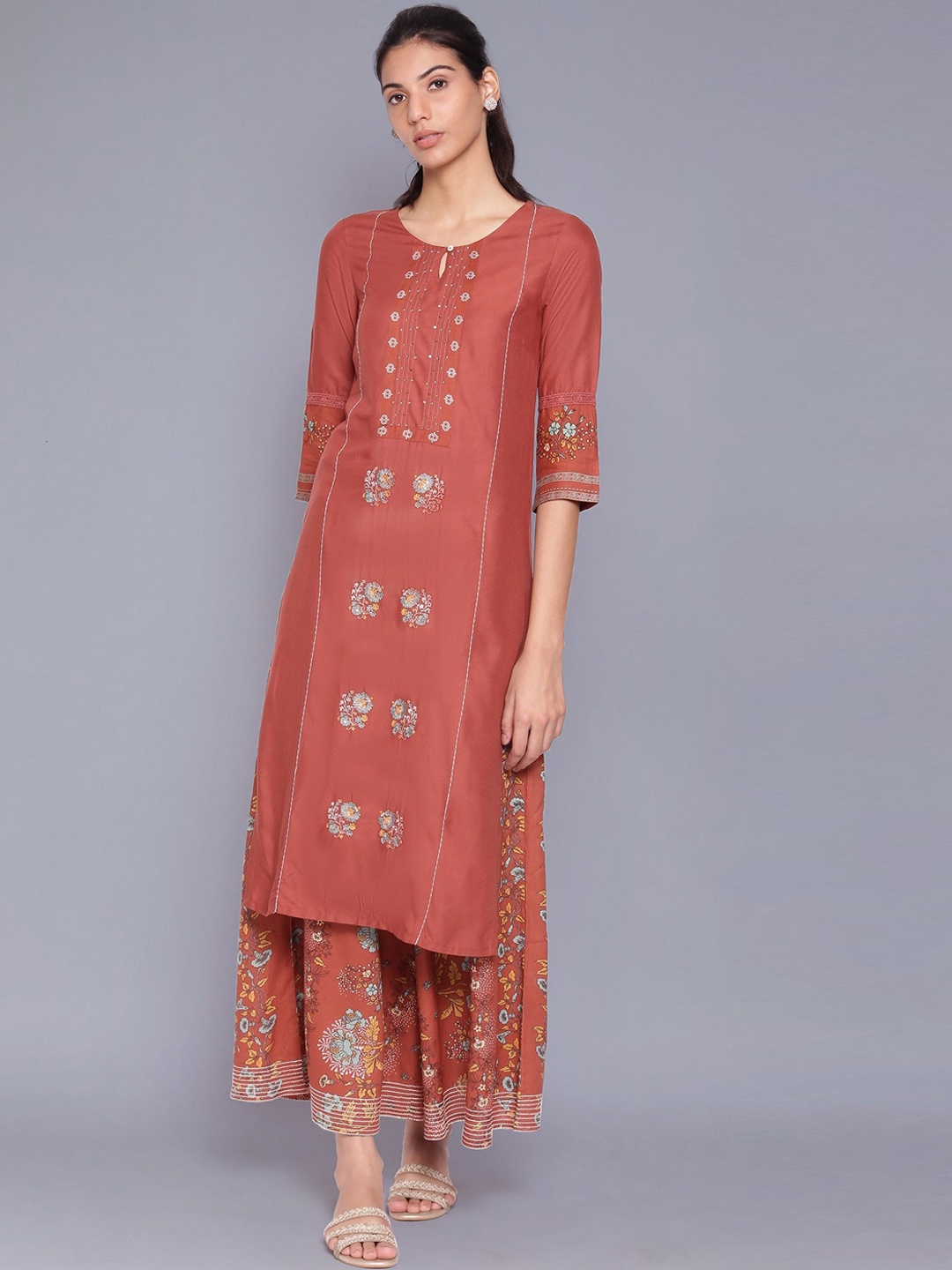

W Women Orange Ethnic Motifs Embroidered Regular Thread Work Kurti with Skirt
