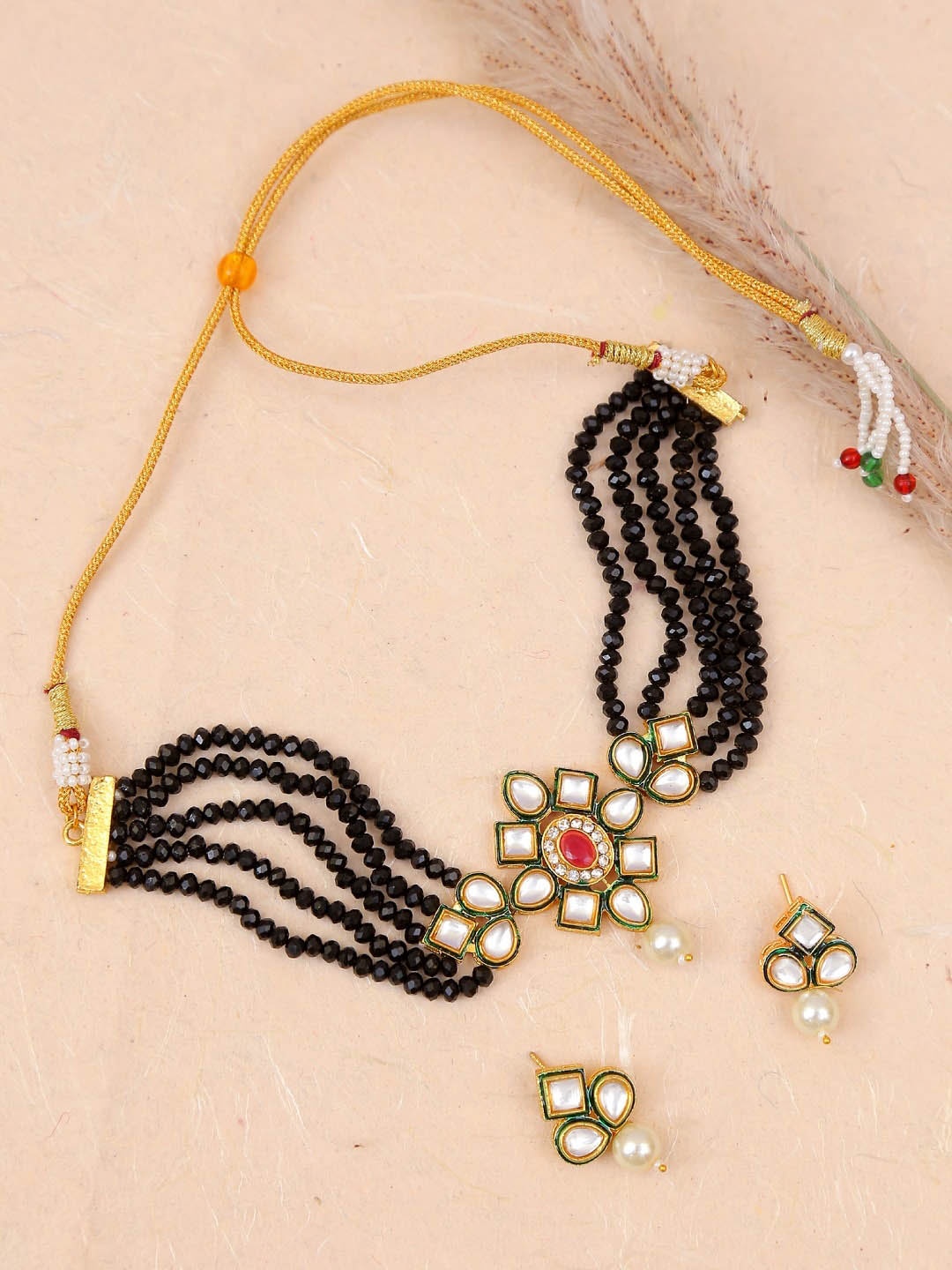 

Crunchy Fashion Gold-Plated White & Black Kundan-Studded & Pearl Beaded Jewellery Set