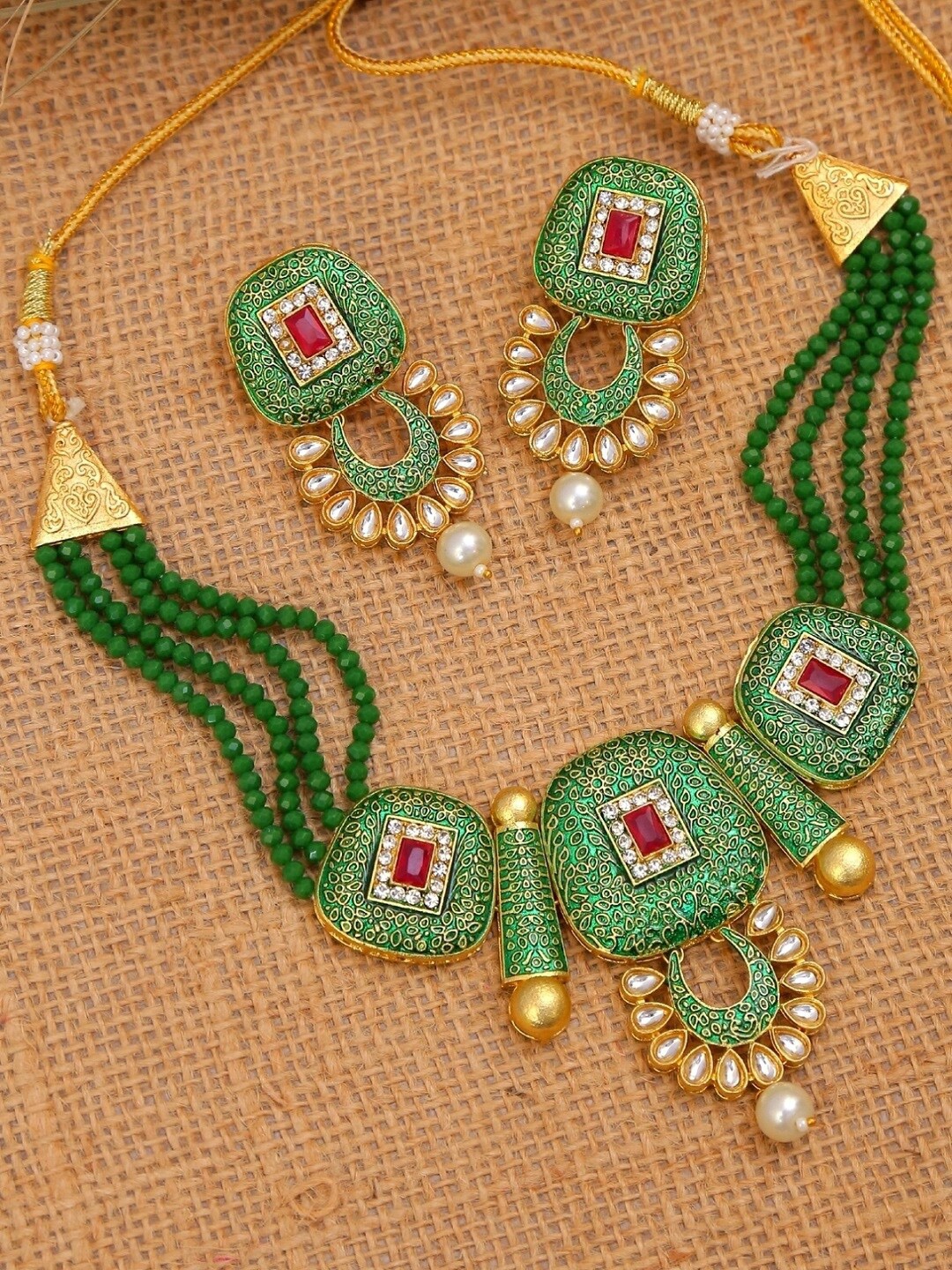 

Crunchy Fashion Woman Green & White Kundan Studded & Pearls Beaded Jewellery Set, Gold