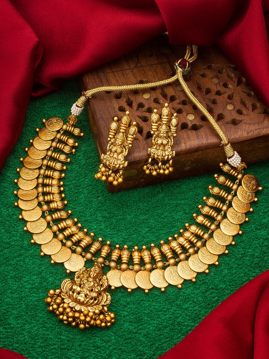 

Aadita Gold-Toned Choker Temple Ginni Jewellery Set