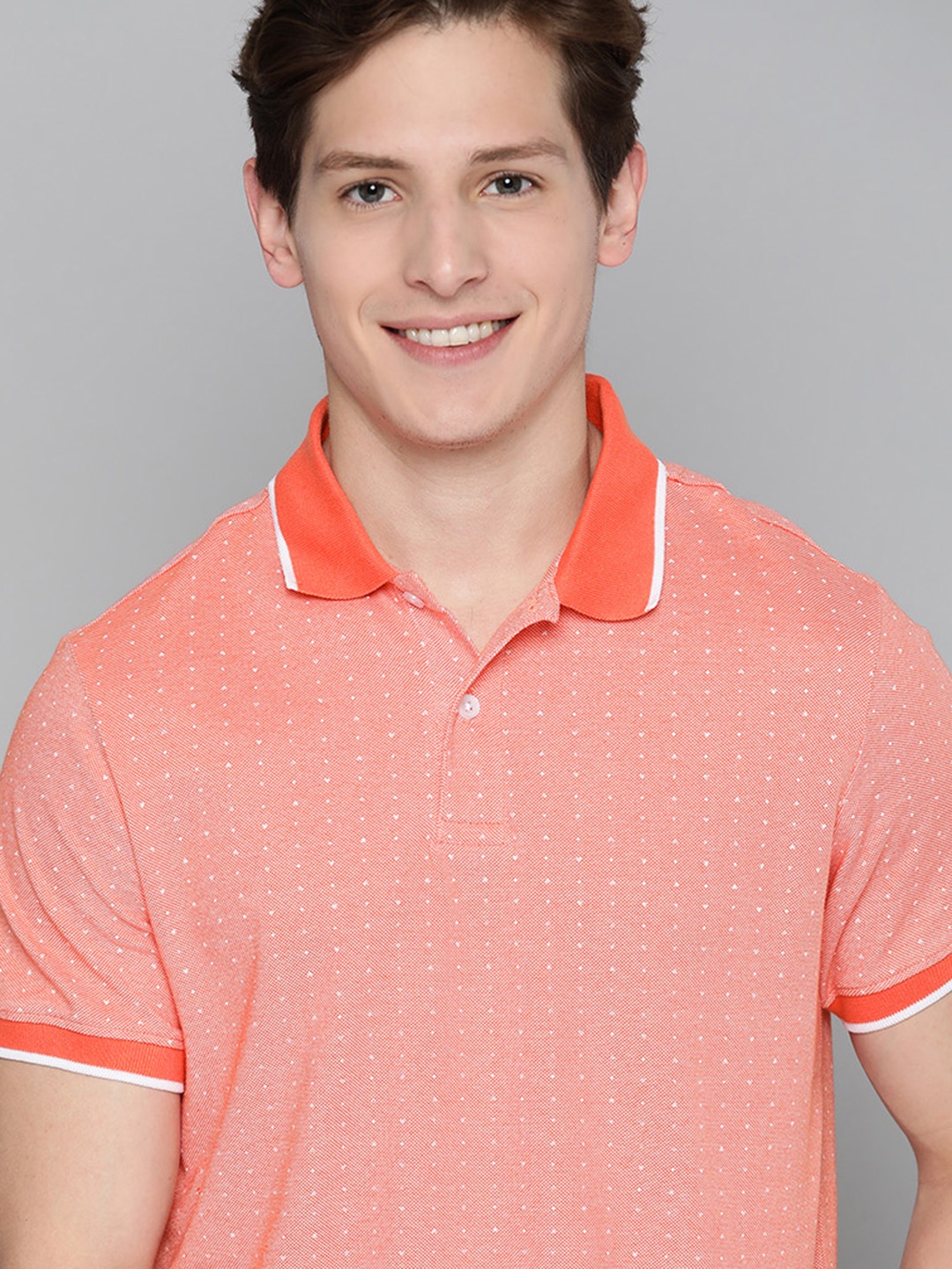 

Mast & Harbour Men Coral Orange & White Self-Design Polo Collar T-shirt