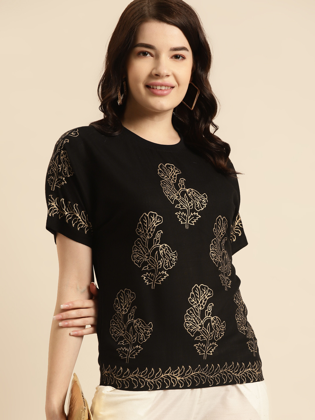 

Prakrti Black & Gold-Toned Ethnic Motifs Printed Casual Regular Top