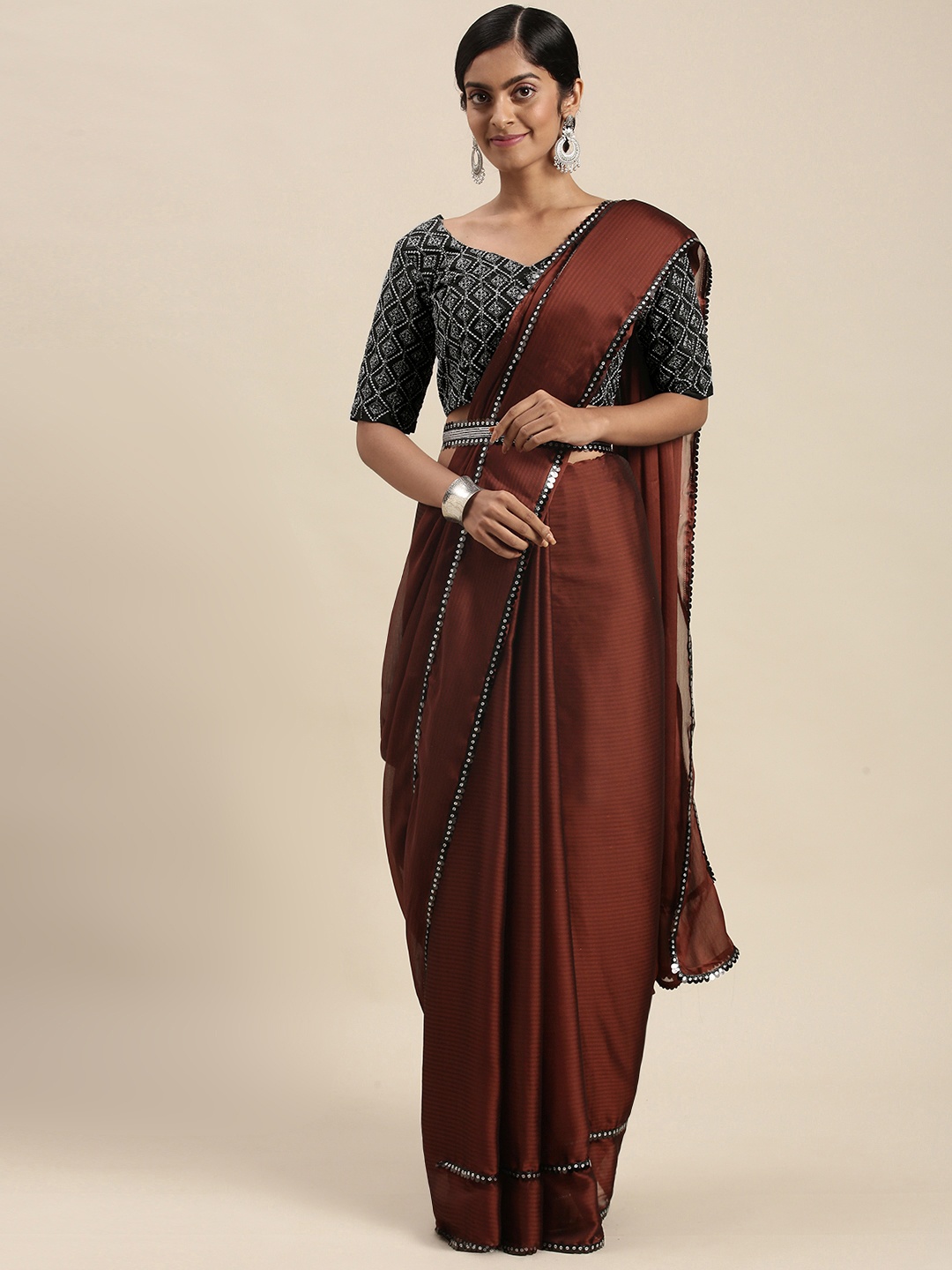 

Mitera Burgundy Sequinned Border Saree