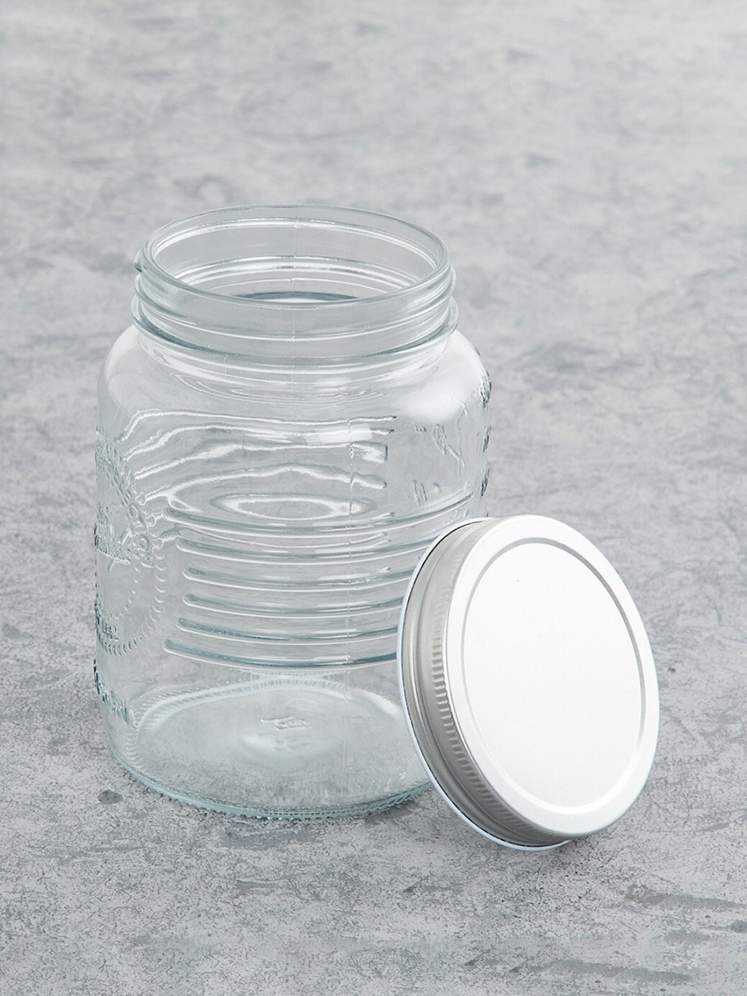 

Home Centre Transparent Textured Glass Mason Jar With Lid