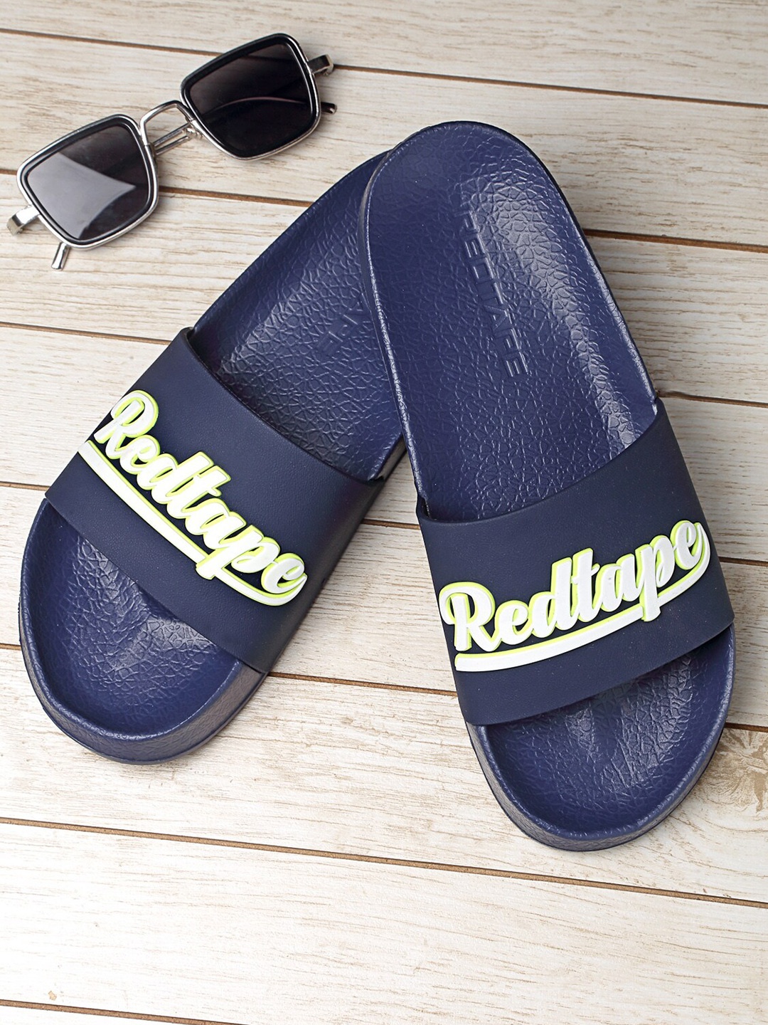 

Red Tape Men Navy Blue Printed Rubber Sliders