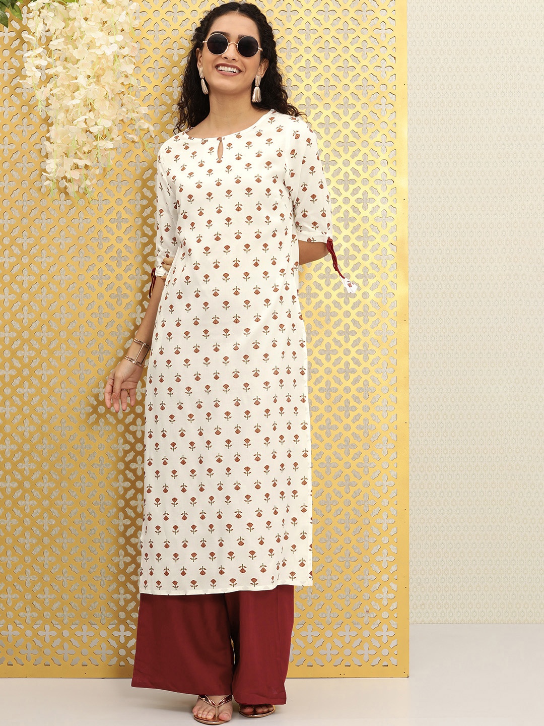 

Ode by House of Pataudi Women White And Maroon Quirky Printed Kurta with Palazzos