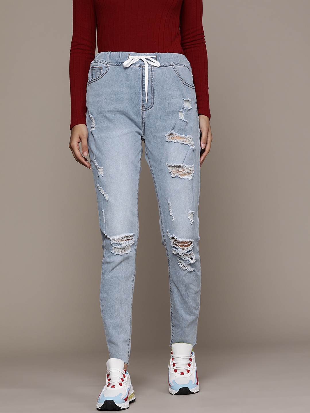 

URBANIC Women Blue High-Rise Skinny Fit Mildly Distressed Light Fade Stretchable Jeans
