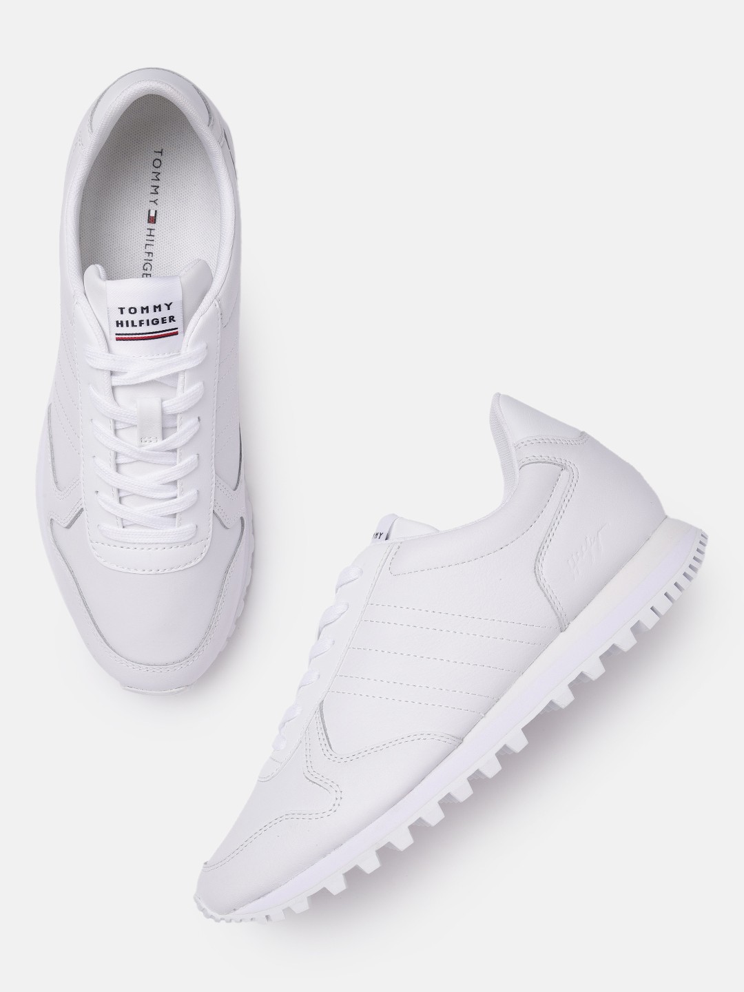 

Tommy Hilfiger Men White Solid Leather Regular Sneakers with Cleats