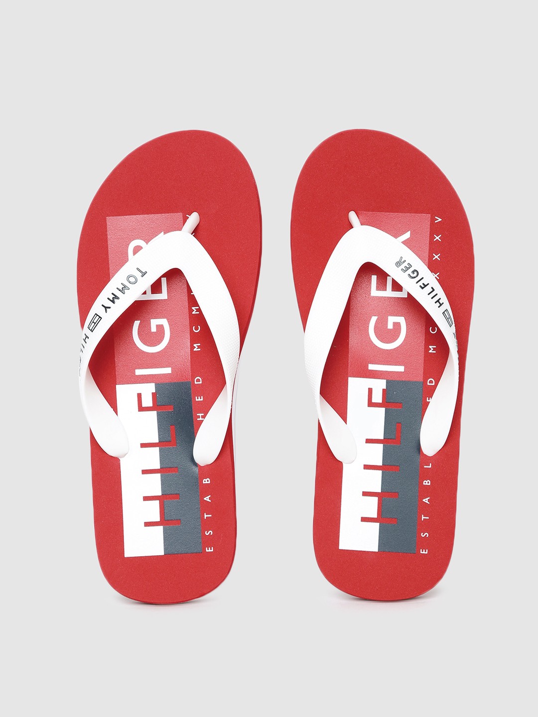 

Tommy Hilfiger Men White Printed Thong Flip-Flops