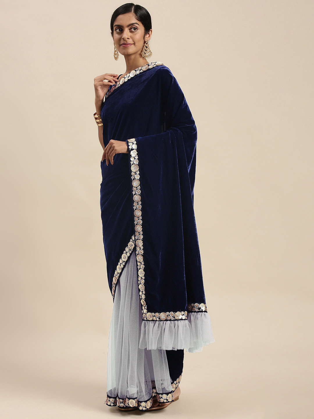 

Sangria Blue Embellished Embroidered Velvet Net Half and Half Saree