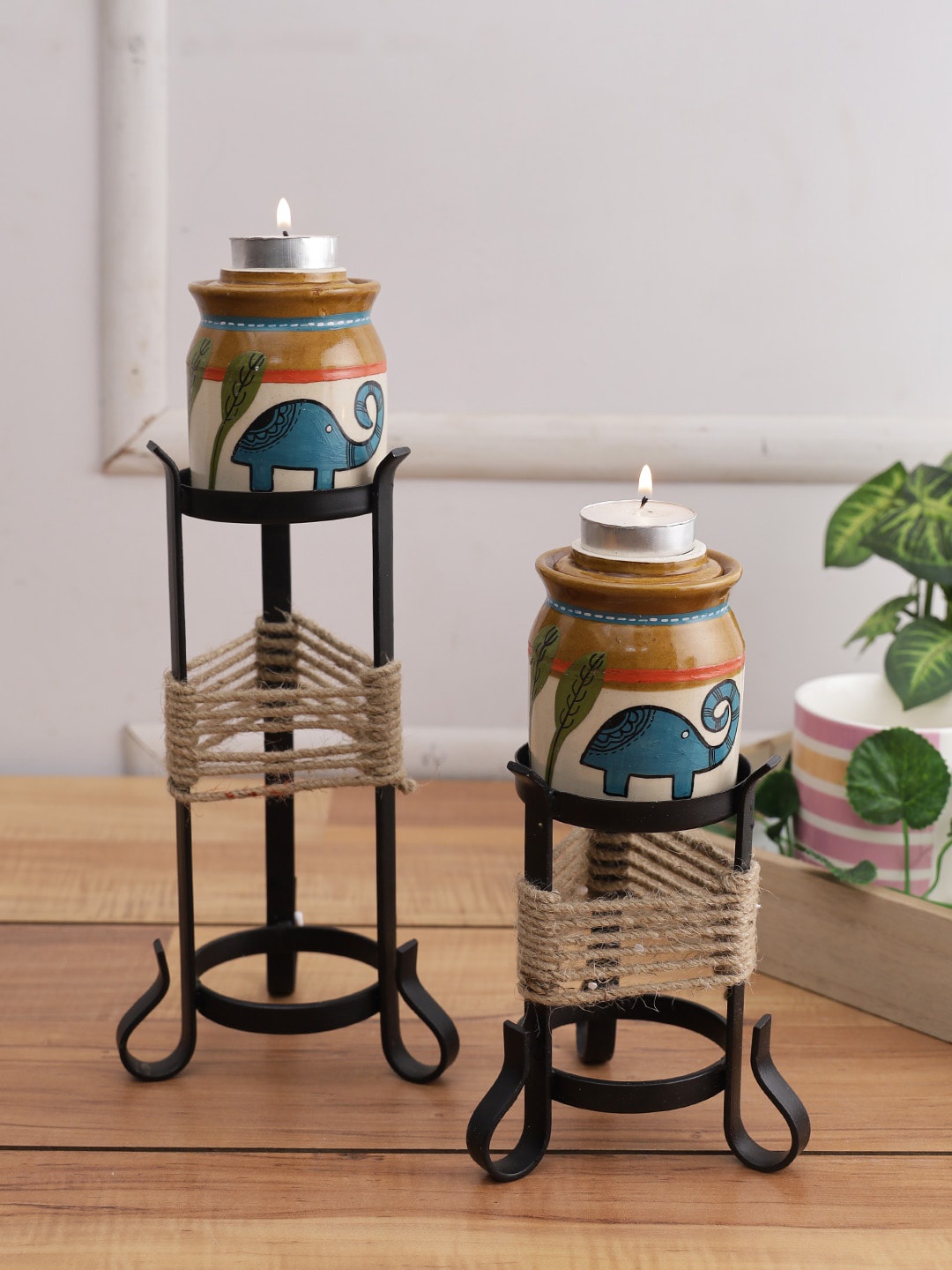 

Aapno Rajasthan Brown & White Tribal Elephant Candle Holder with Decorative Stand