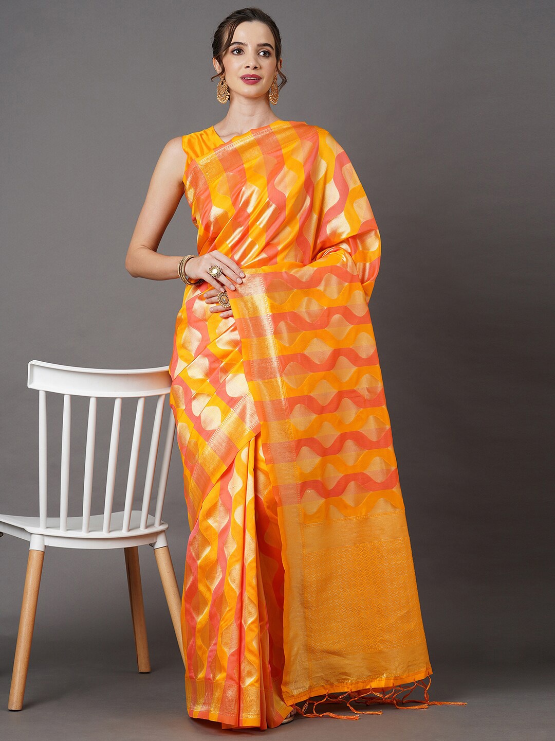 

Mitera Yellow & Orange Ethnic Motifs Zari Silk Blend Banarasi Saree