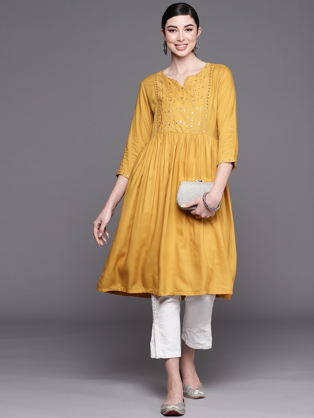 

Biba Women Mustard Yellow Embroidered Mirror Work Yoke Design A-Line Kurta