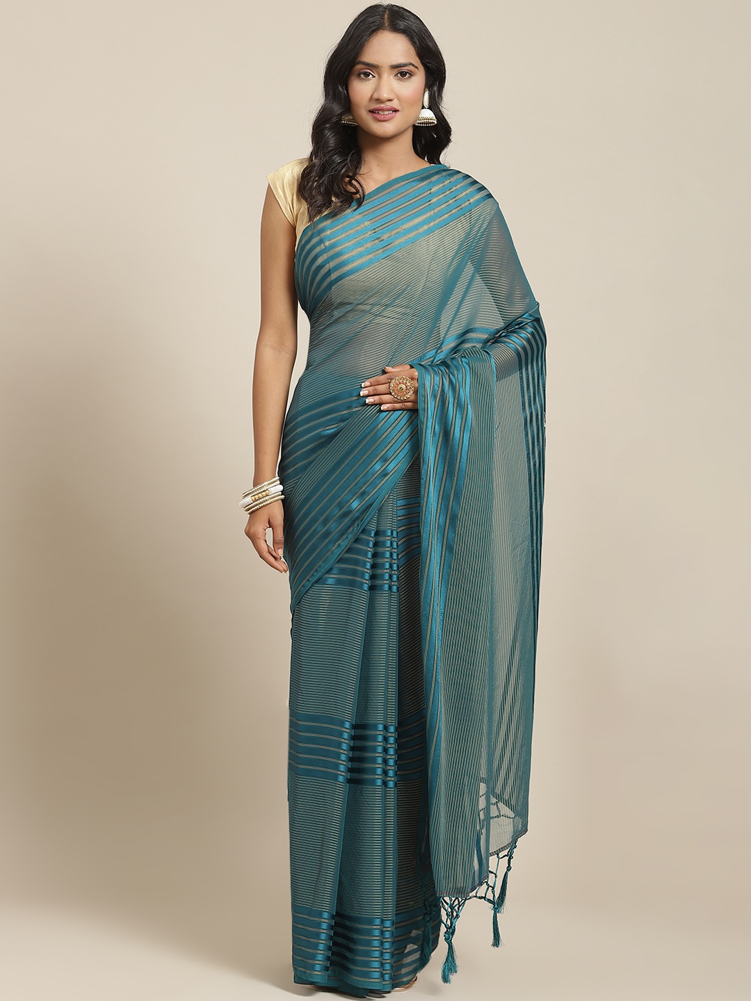 

Nanda Silk Mills Teal Green Striped Saree