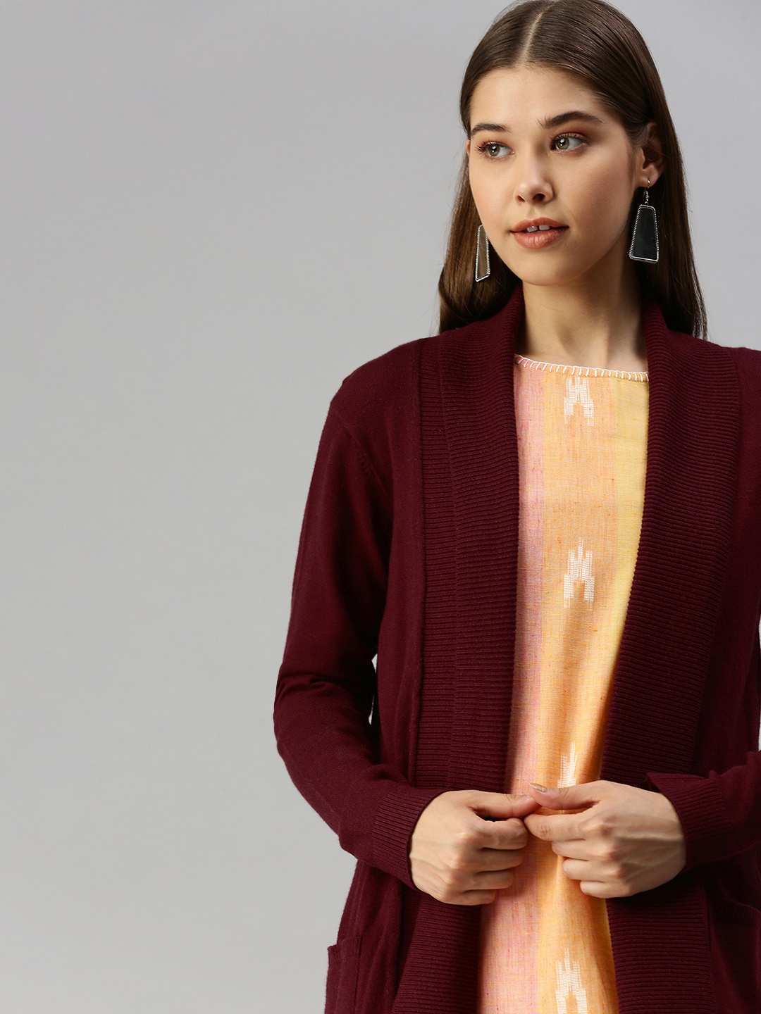

Global Desi Women Burgundy Solid Longline Shrug